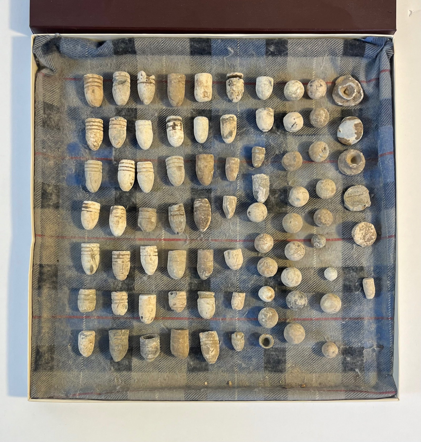 Civil War Bullets: 47 .58 bullet casings from the civil war along with 25 .69 round balls along with 6 casing backs all within a small box. Box Measures 11.75in x 11.75in x .75in