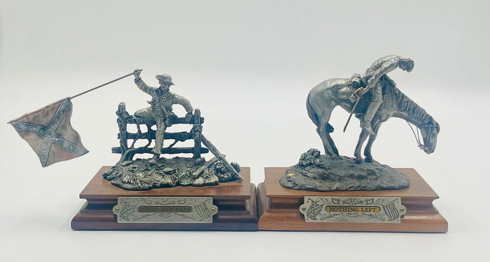 Stars and Bars and Nothing Left: "Stars and Bars" and "Nothing Left" are two pewter statues created by Francis Barnum. The "Stars and Bars" is signed on the wooden base by the artist but both have been signed with his name on the gro