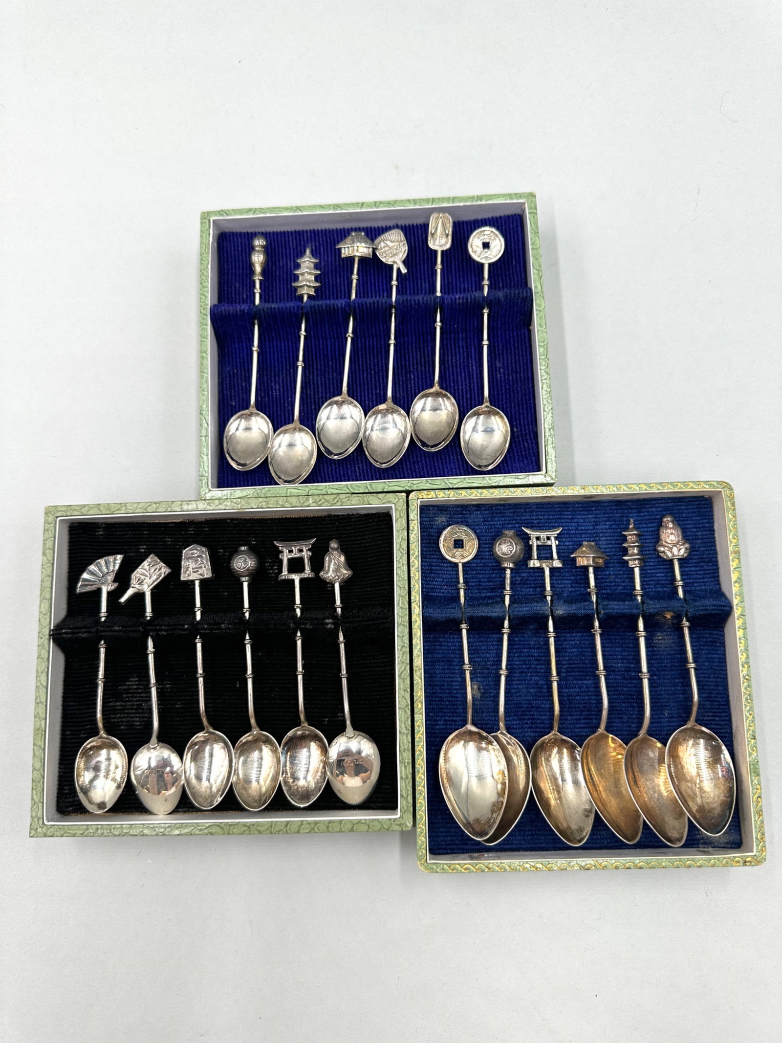 Three Sets of Sterling Demitasse Spoons: Three Sets of Sterling Demitasse Spoons all of which are in sets of six, for a total of 18 spoons. The bowls are a standard oval like shaping but are marked on the back with "sterling 950". The handle