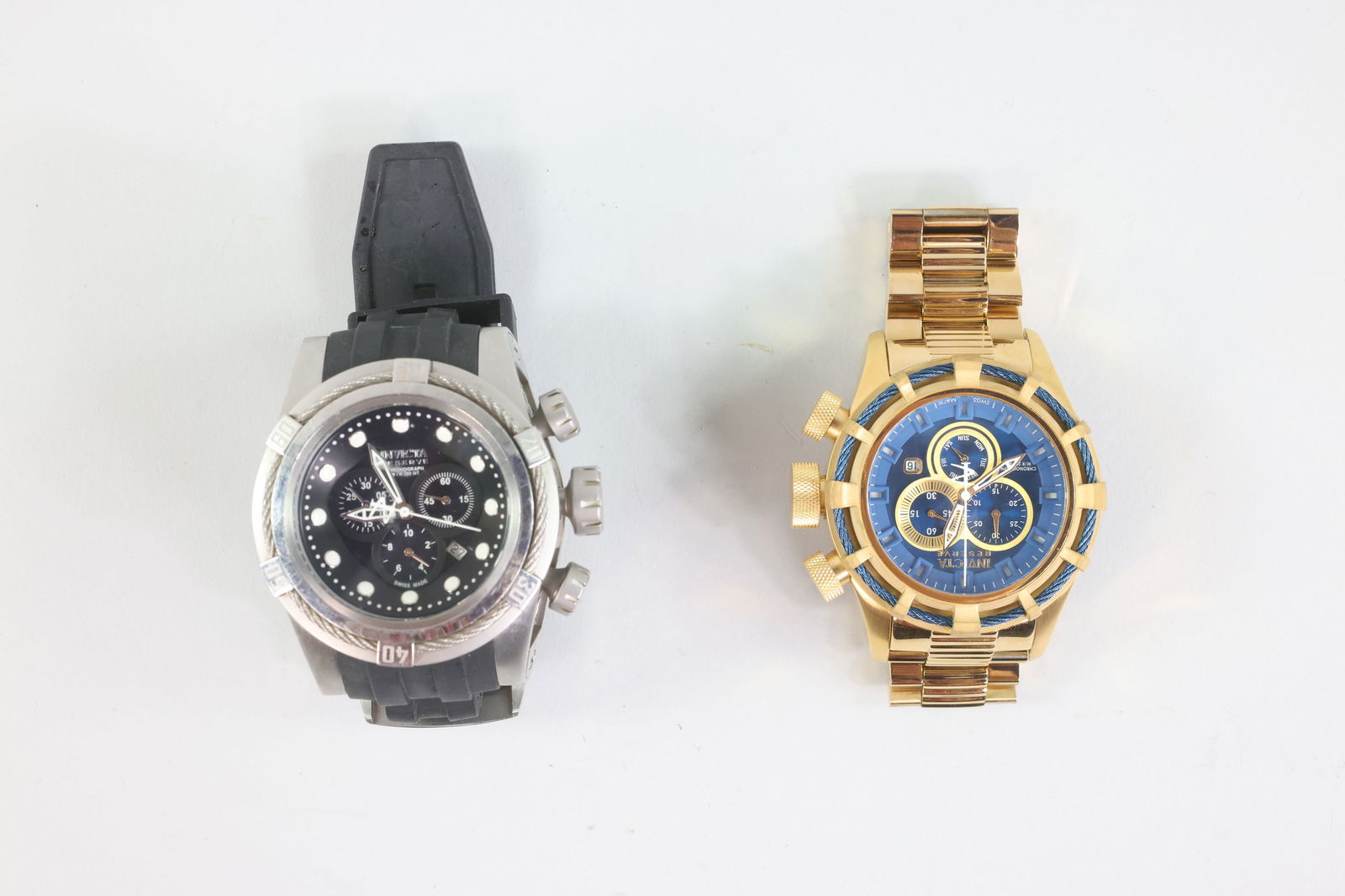 Invicta Reserve (15785 and 0826) Watches: (15785) Bolt Zeus Chronograph, 50mm, Swiss component, stainless steel gold/blue face, and gold band Measures 5.5in Bezel Measures 49.64x50.33mm (0826) Bolt Zeus Chronograph Case Size:53mm Case Materia