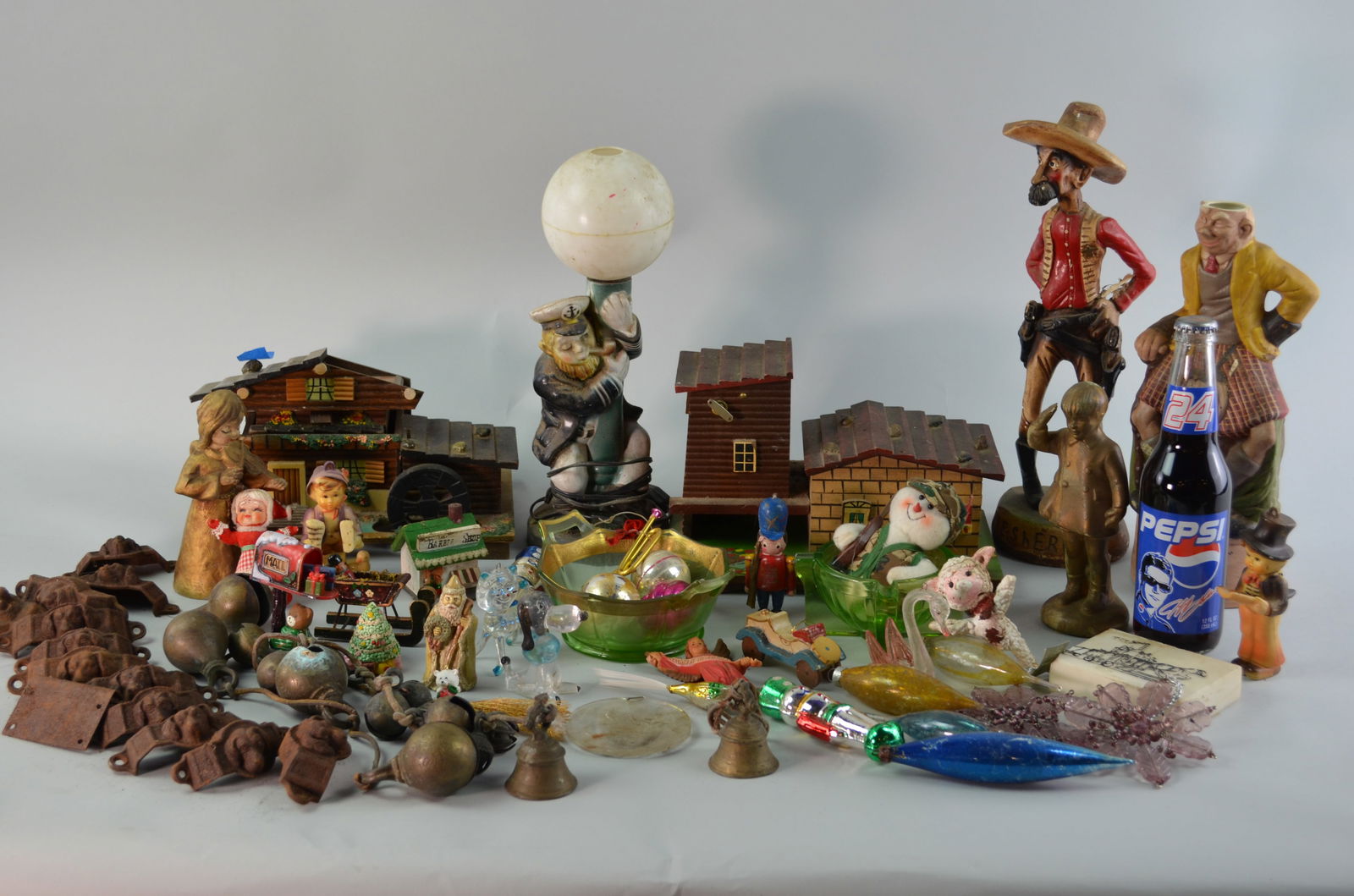Home Decor and Christmas Decor: Includes two vintage handcrafted wooden Swiss chalet jewelry and music boxes. The lot also includes 3 figurines, a decanter, or lamp in the shape of a Sheriff, a Scotsman, and a Sailor. And includes a
