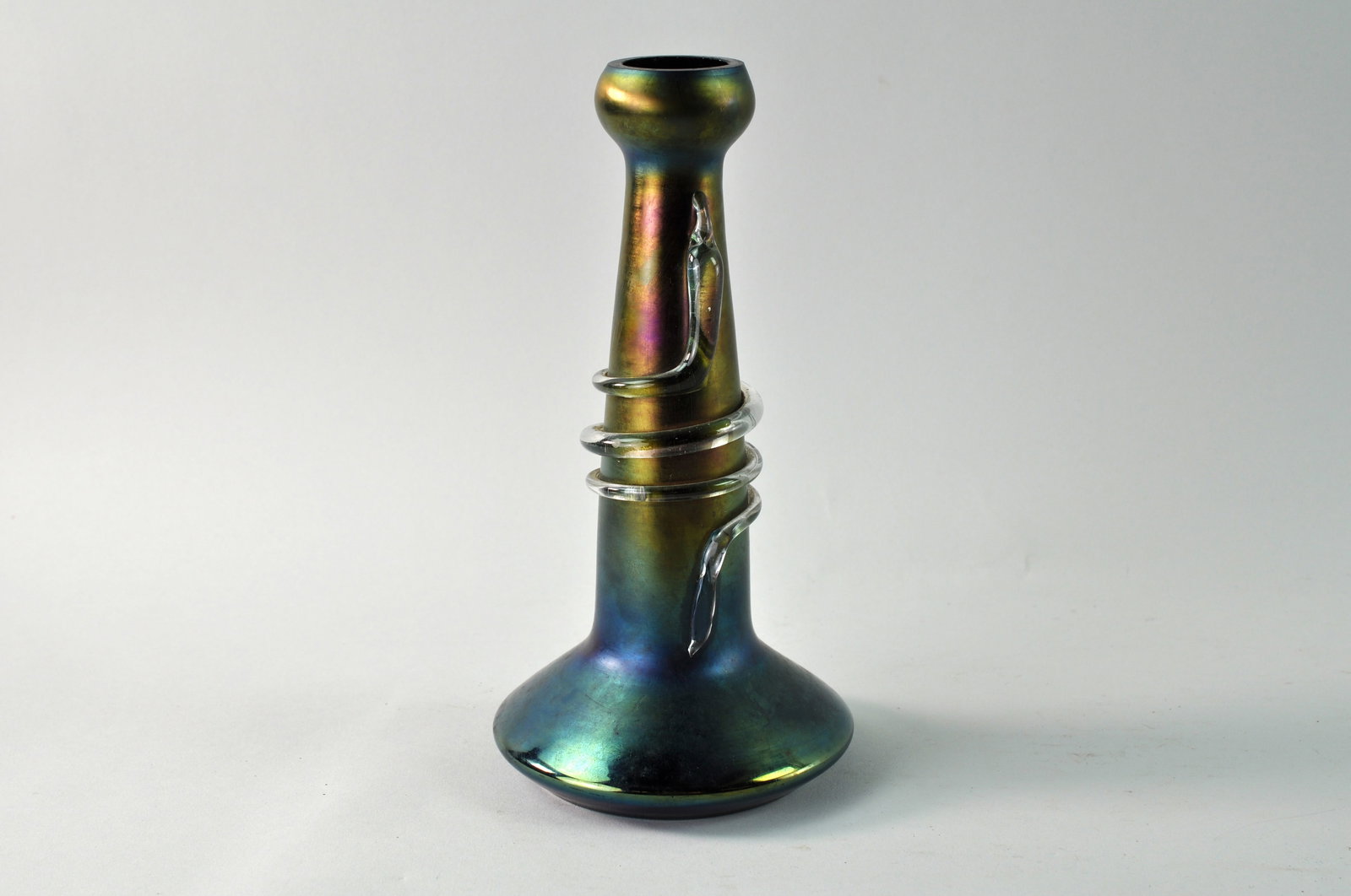 Loetz Glass Art Nouveau Snake Vase: Art Nouveau Bohemian glass Loetz vase. The vase is iridescent with a clear glass snake design that wraps around the neck. The vase is in excellent condition other than a slight chip on the lip of the