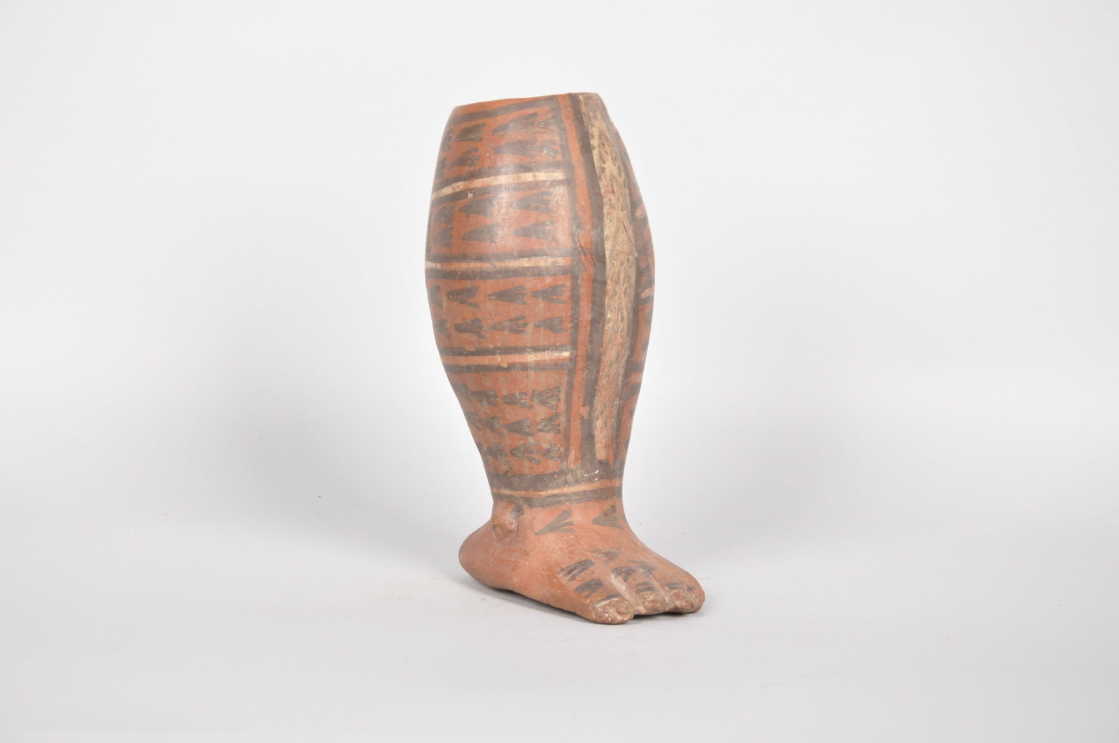 Wari (Huari) Foot and Calf Vessel: Origin: Wari (Huari), Pre-Columbian 1100-1400 Dimensions: 3.5x5x9in C