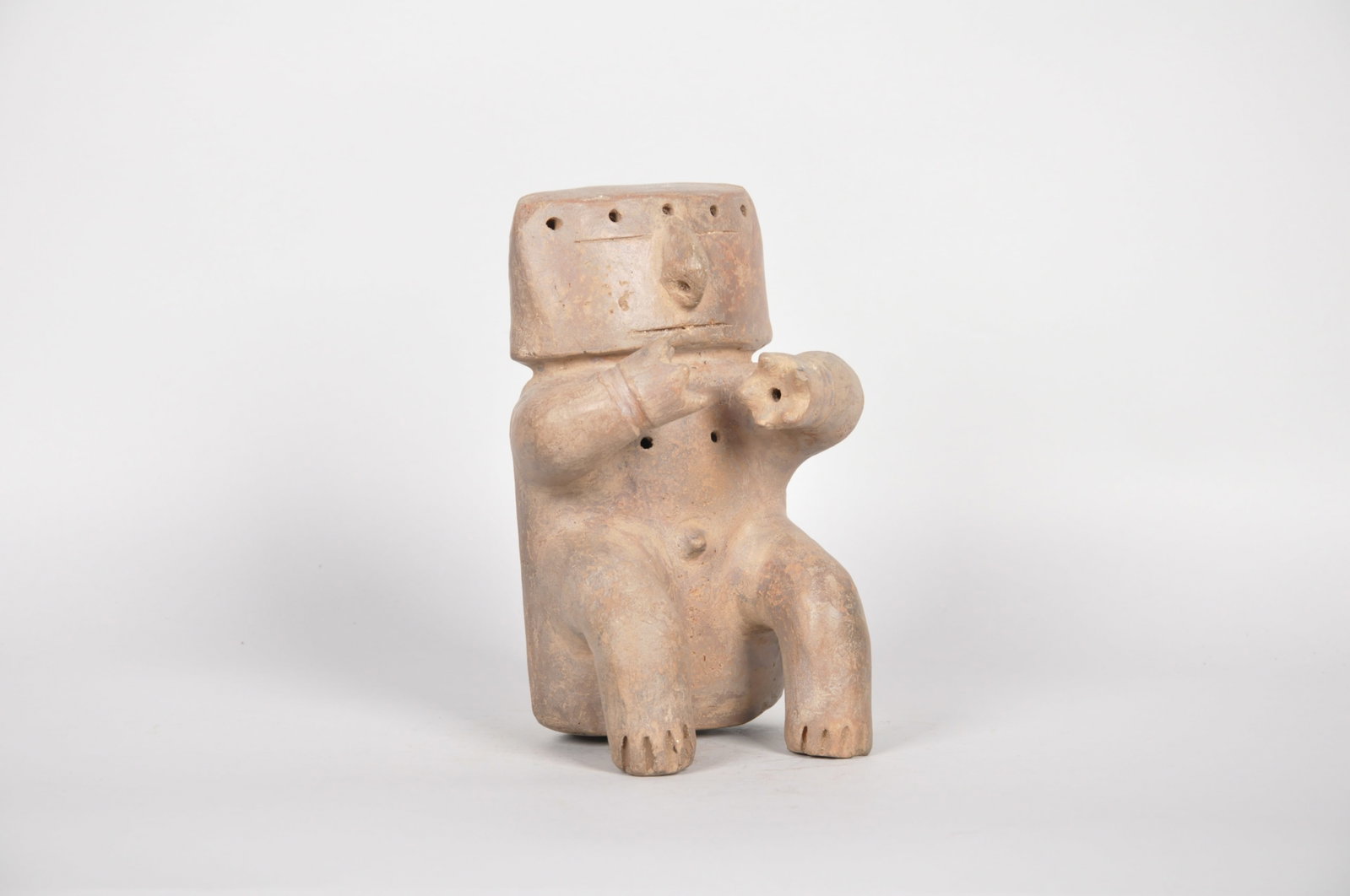 Pre Columbian Terra Cotta Slab Figure Quimbaya Culture: Origin: Pre-Columbian, Colombia, Middle Cauca/Quimbaya culture ca. 7th- 15th century Dimensions: 5x4x7.5 in. Conditi
