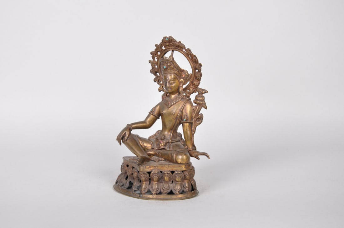 Bronze Seated Bodhisattva: Origin: Tibet or Nepal, Early to Mid 20th century Medium: Bronze Dimension: 8x4.5x3.5in <