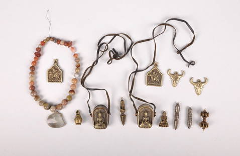 Tibetan Ghau, Bronze Pendants, and a Stone Necklace: Origin: Tibet Medium: Bronze, Brass, Copper, Cowhide, and Stones Dimension: Ghau: 1.5x2x.5in