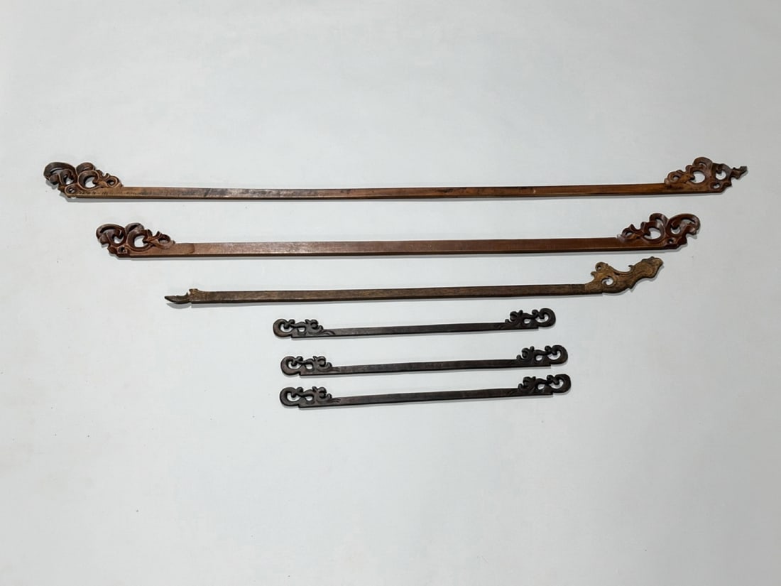Six Carved Wooden Scroll Textile Hangers: Origin: Indonesian Dimension: Longest 65x0.5x3.75 in. Condition: Wear of the wood on each and some