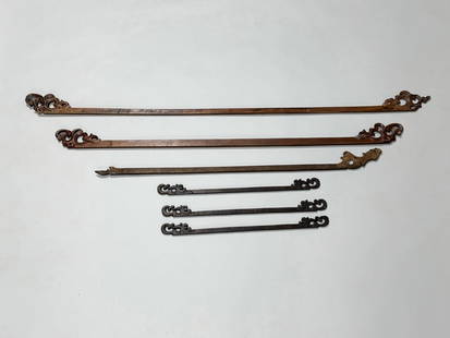 Six Carved Wooden Scroll Textile Hangers: Origin: Indonesian Dimension: Longest 65x0.5x3.75 in. Condition: Wear of the wood on each and some