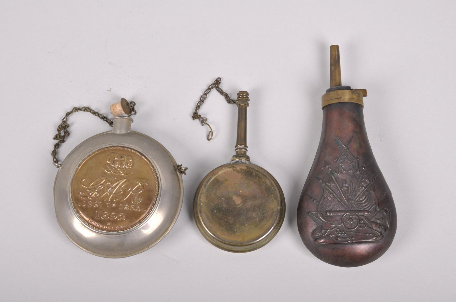 19th and 20th C. Gunpowder Flask Canteen and A Rifle Oiler: Origin: United States of America Dimensions:</
