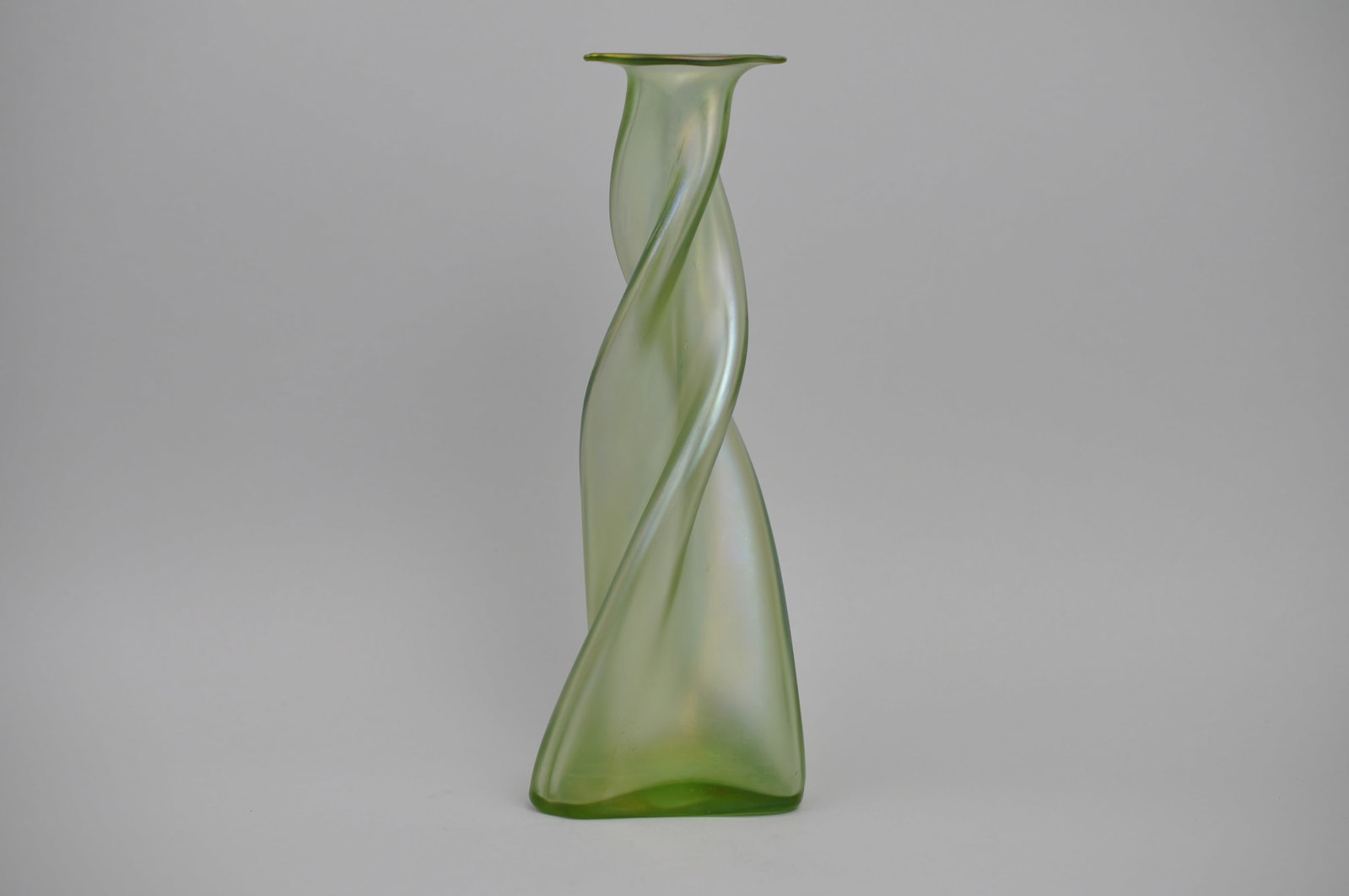 Loetz/Kralik Spiral Green Single Bud Vase: Dimensions: Approx 1/2x 1/2x10 1/4" Condition: Light Scratches, Flea Chip Additional Information: This spiral gr