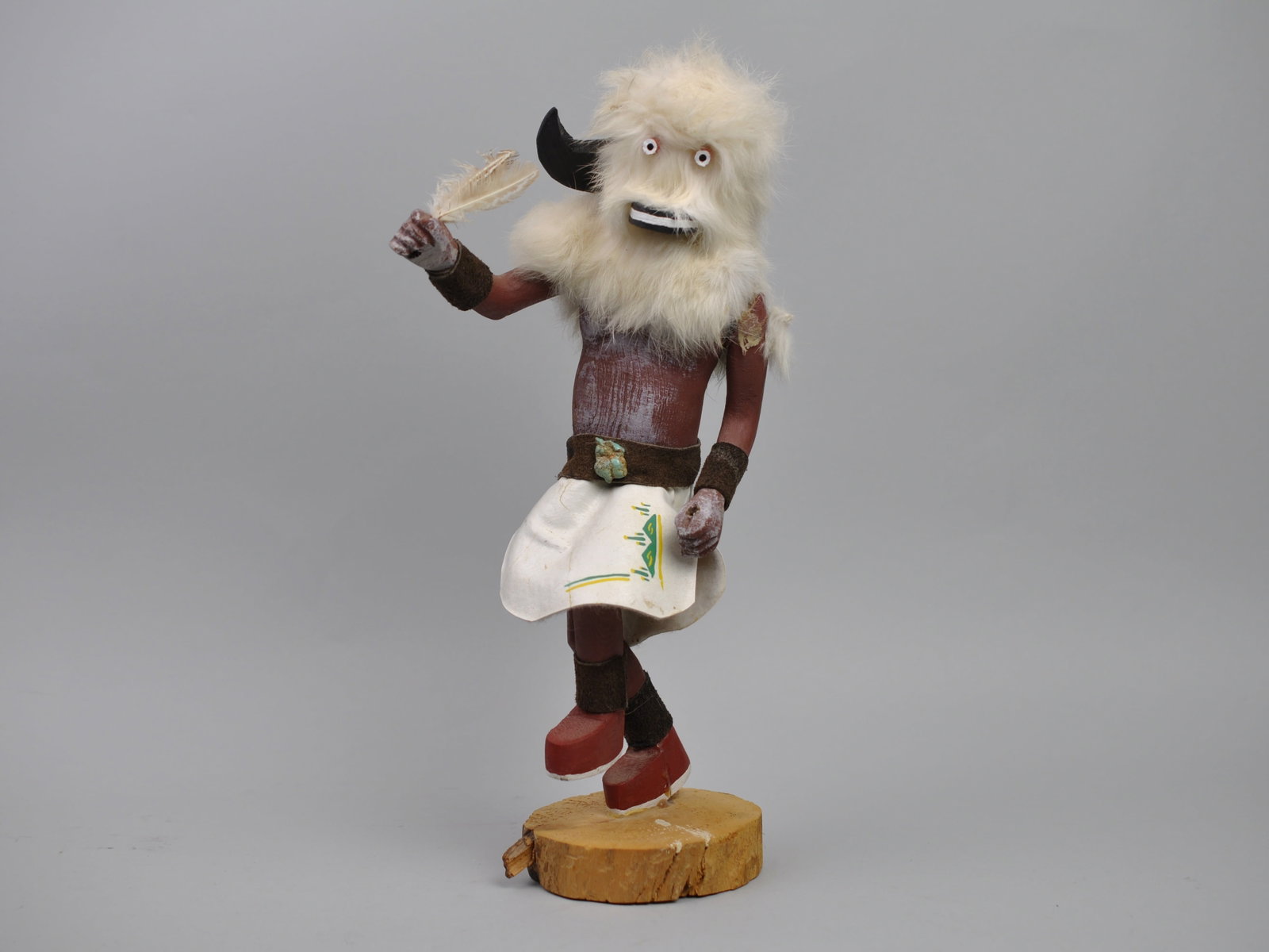Navajo Kachina Doll White Fur Buffalo: Origin: Native American Medium:?Carved Wood Dimensions:?4x7x14" Condition:?Figure Has Been Broken and Repaired with Glue at Base, Waist, Skirt and Horn