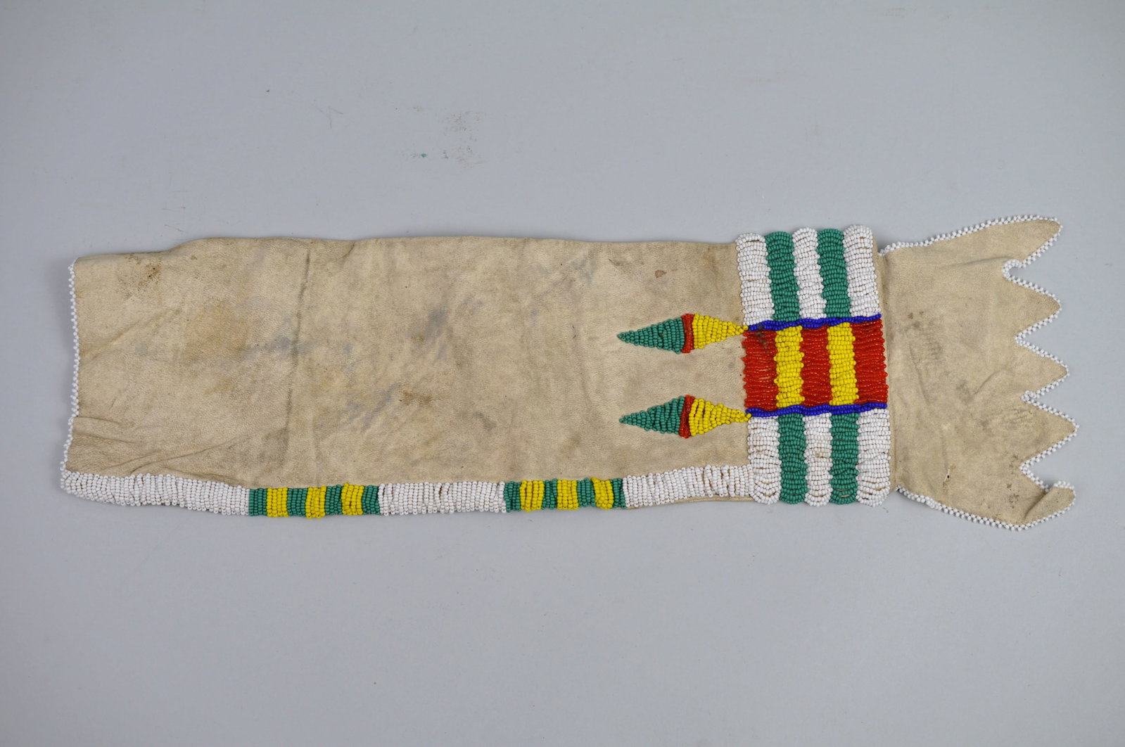 Native American Beaded Chanupa Pipe Bag: Dimensions: Approx. 18x5" Condition: Skin has Some Dirt Marks Additional Information: This Native American beaded chanupa pipe bag is far more than carrying pouch; it is vessel of tra