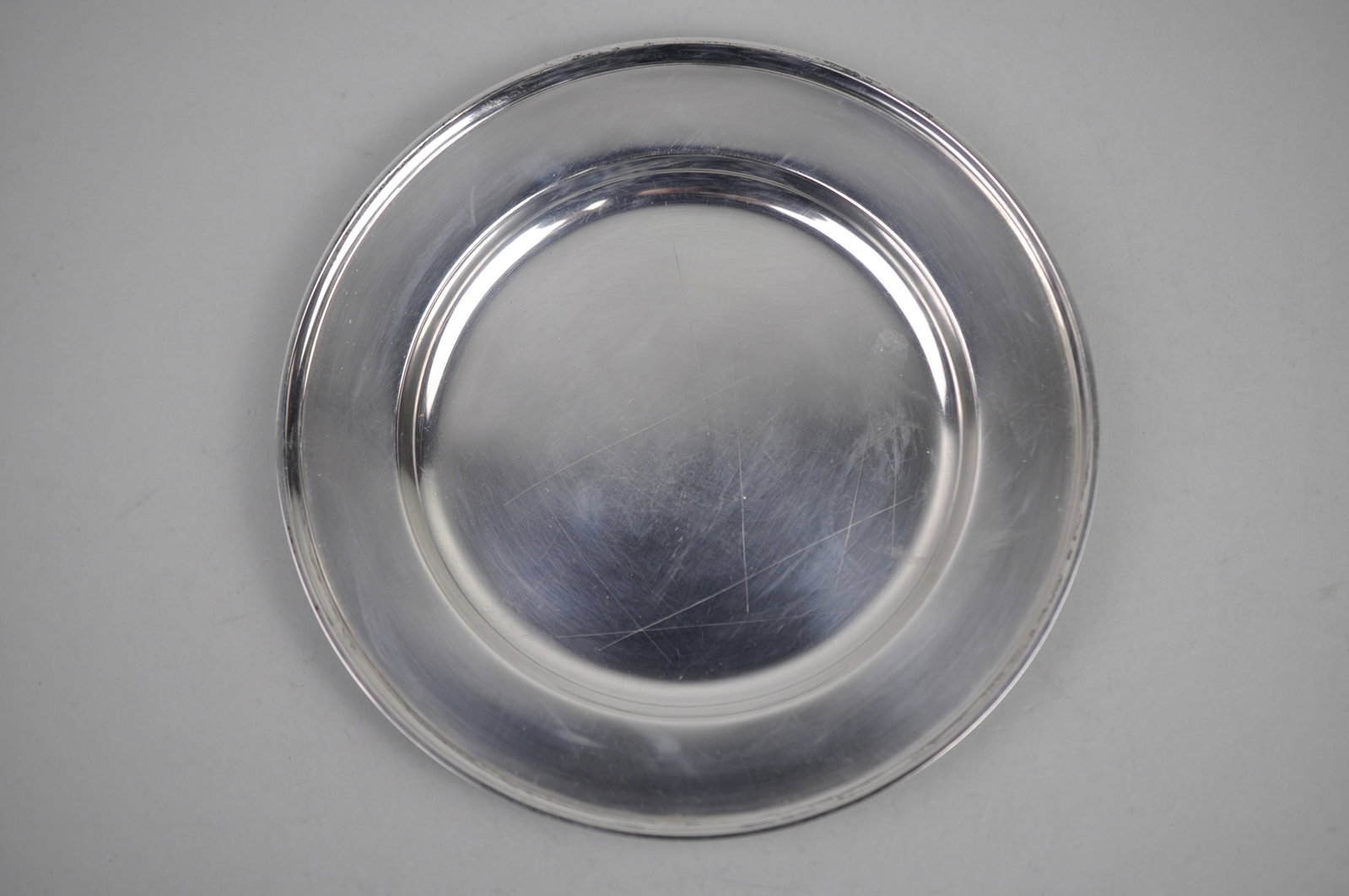 S. Kirk Son Co Sterling Silver Plate Saucer: Metal: Sterling Silver Manufacturer:?S. Kirk & Son Dimensions: 1/4" We