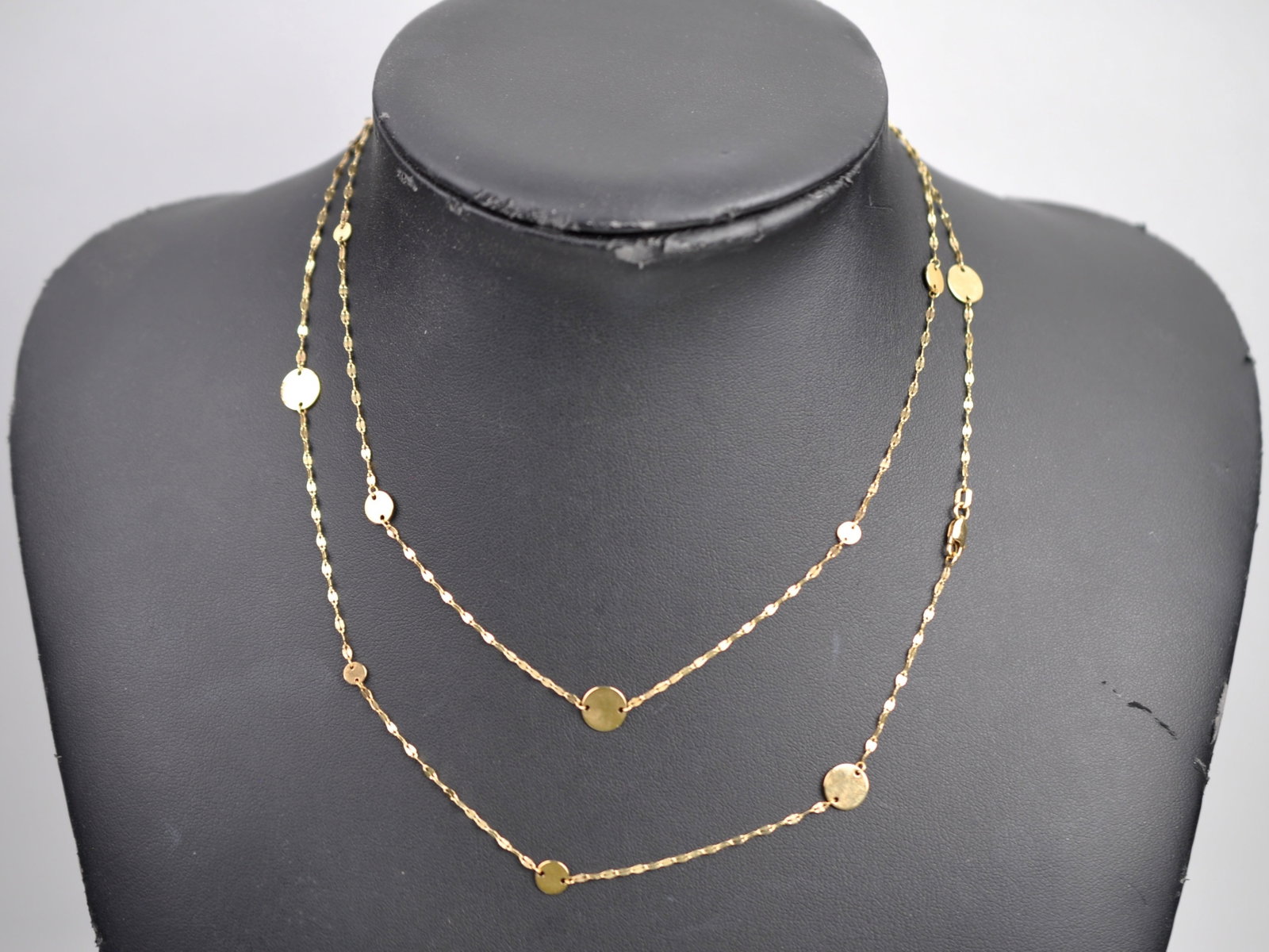 14K Gold Necklace: Metal:?14K Yellow Gold (marked) Stone Types:?None Dimensions:?Approx. 18" Weight: Approx. 0.19ozt Condition: Light Scratches Additional Information:?14K yellow gold station necklace featuring