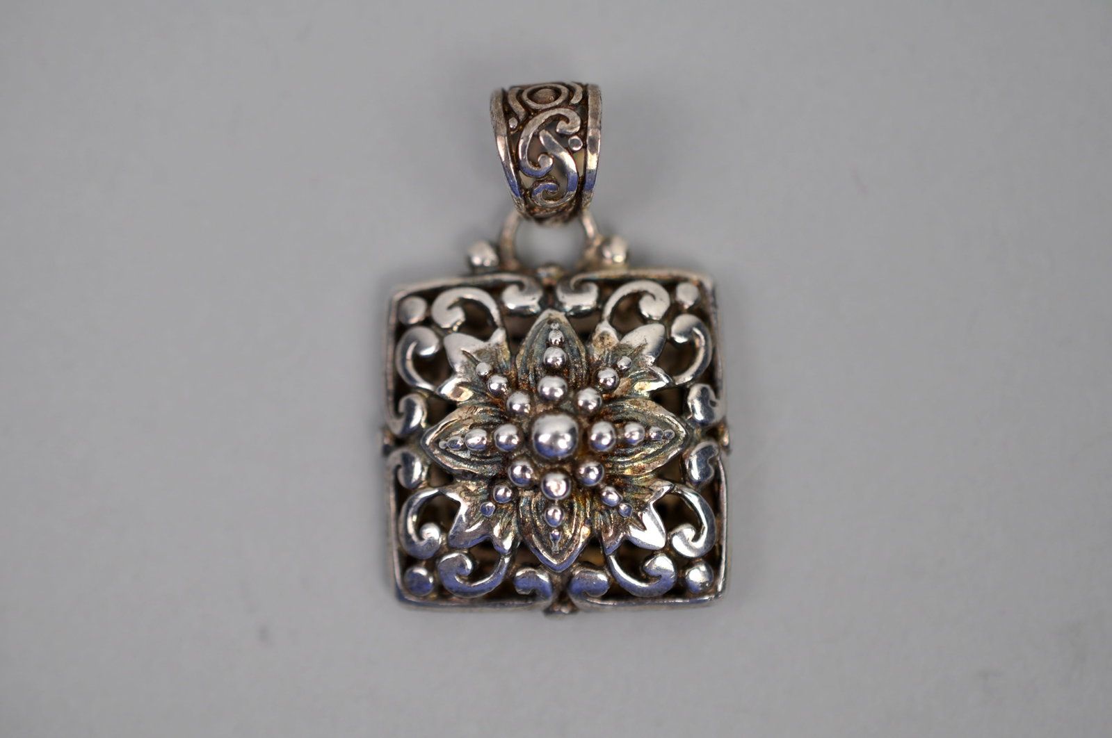 Sterling Silver Pendants: Metal:?Sterling Silver Stone Types:?None Dimensions:?Approx. 1" Weight:?Approx.0.25ozt Condition:?Light Patina Additional Information:?Signed SARDA sterling silver pendant featuring an ornate floral