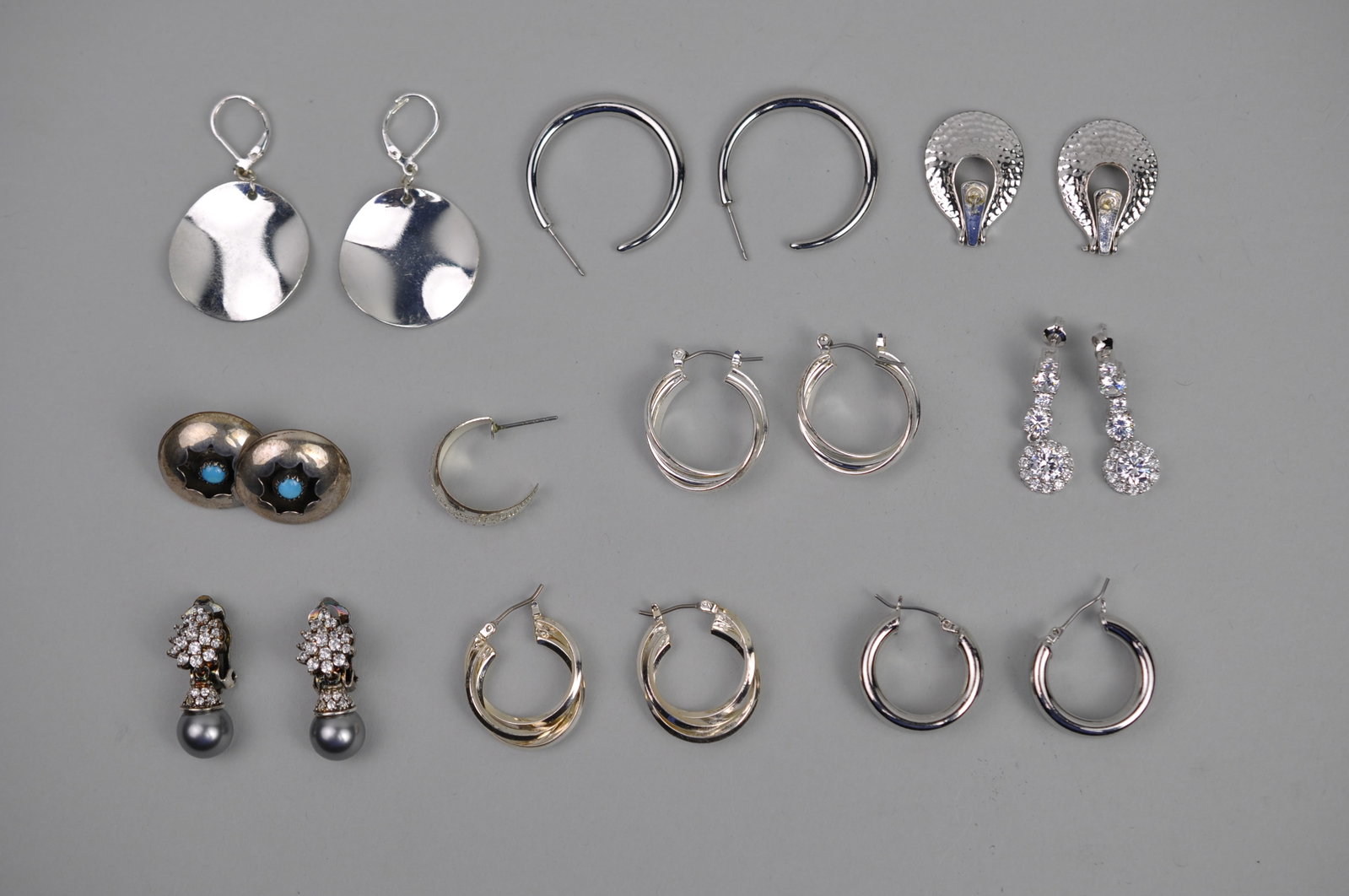 Silver Tone Earrings: Metal:?Various Stone Types:?Various Dimensions:?Various Weight: Approx. 2.41ozt Condition: Various Additional Information:?Assorted fashion jewelry earring lot featuring variety of contemporary and