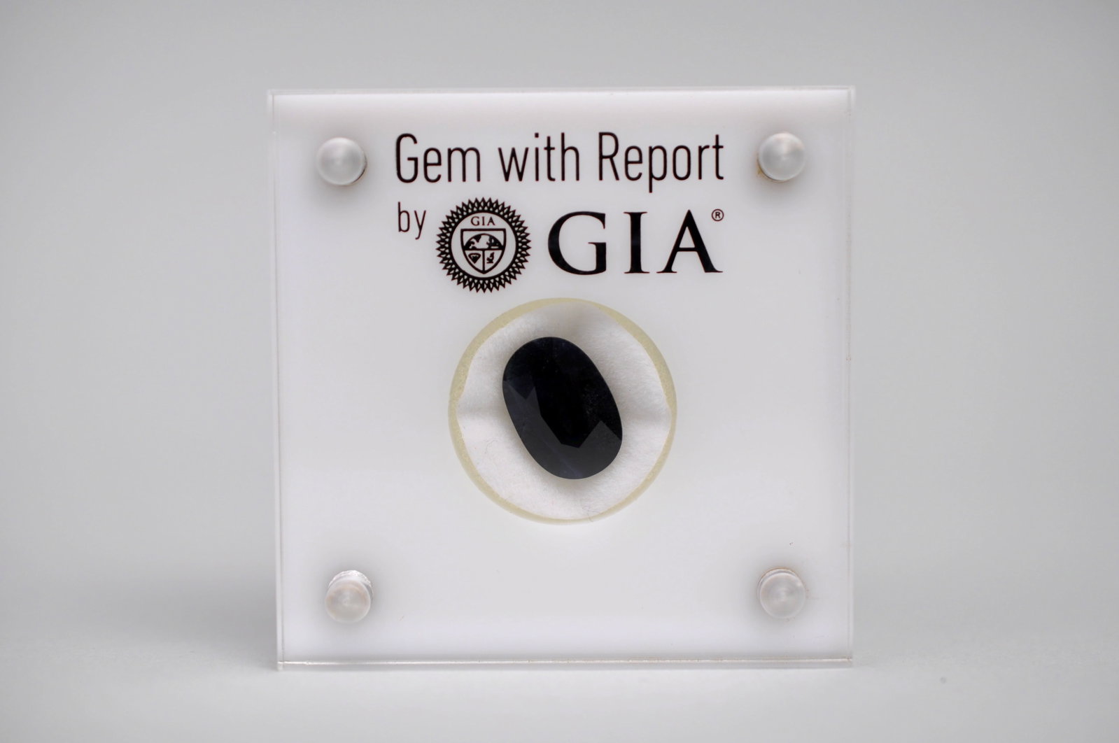 Natural Corundum Sapphire: GIA Gemstone Certification Stats Dimensions:?13.14 9.04 5.69 mm Weight:?6.05 carats Mohs Hardness: 9 Toughness: Excellent Shape:?Oval Color: Dark Blue Transparency: Translucent to Opaque Cutting