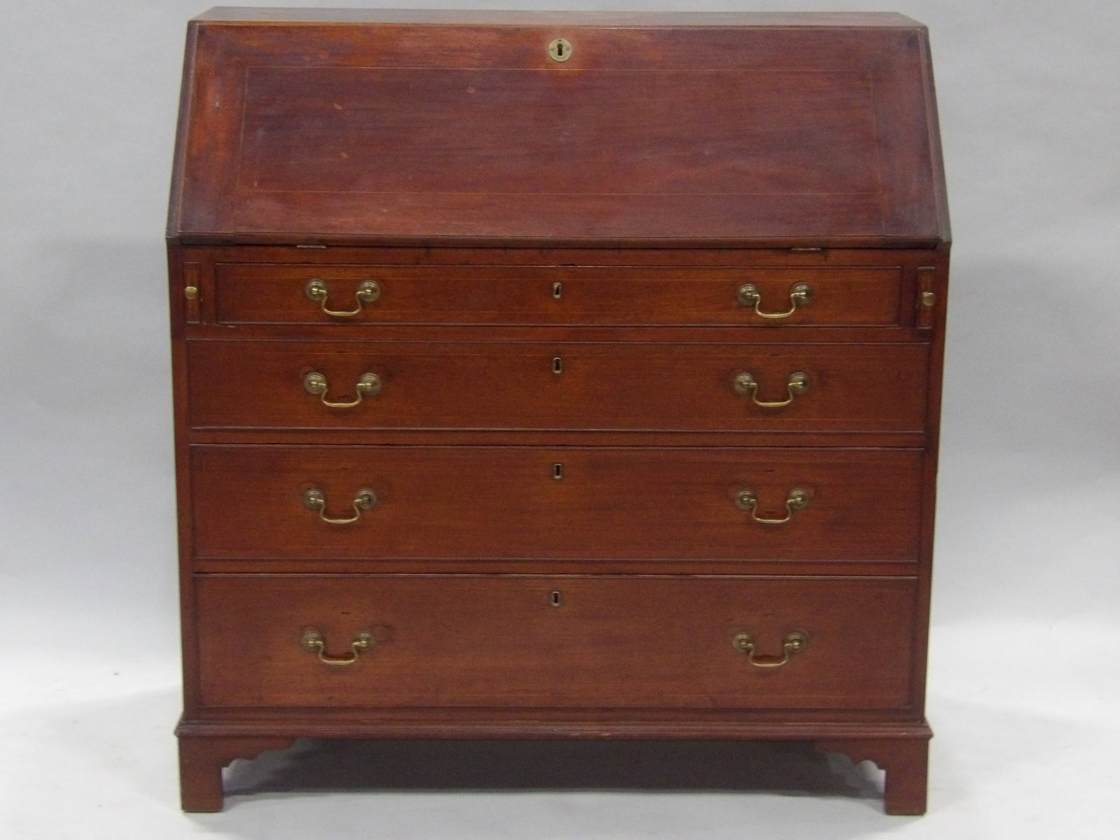 Federal Walnut Chippendale Desk: Dimensions: 41x20x43" Condition: Handles and Feet have been Replaced, Trim to the Right of the Third Drawer Split but Still Attached Additional Information: This Federal walnut Chippe