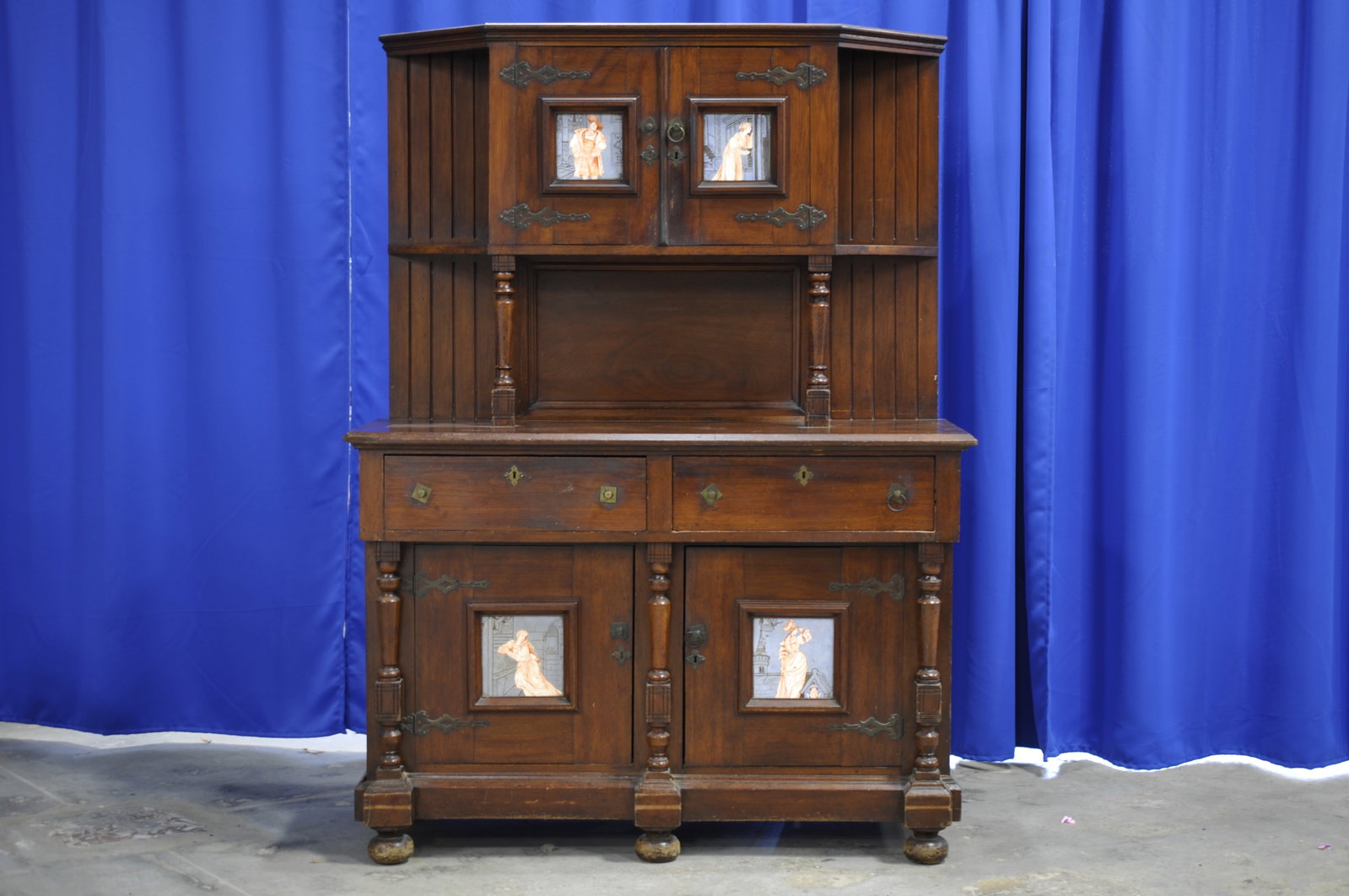 Vintage Wooden Sideboard with Decorative Tile Insets: Origin:?1900s (estimate) Dimensions:?50x20x68" Condition: Left Front Corner Broken, Multiple Handle Rings Missin