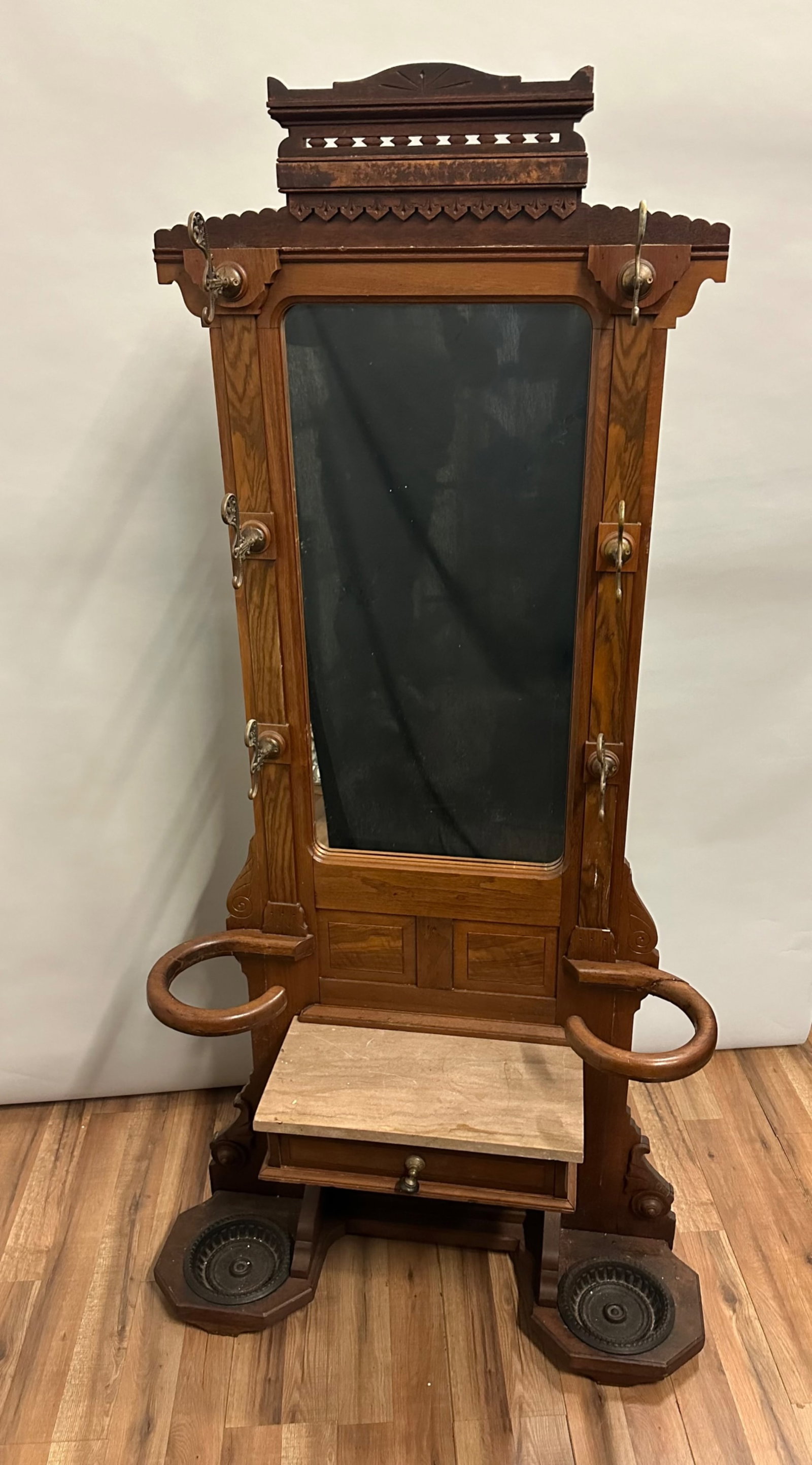 Hall Tree Walnut Victorian: Condition: One umbrella arm has been repaired although over all the piece is in very good condition. <