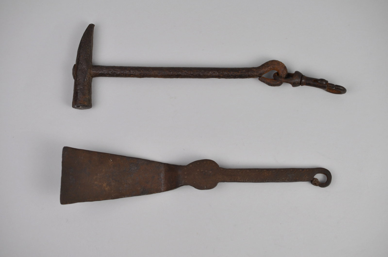 Wrought Iron Tools: Manufacturer: Hand Made Dimensions:?Various Condition:?Rusty Additional Information:?This grouping of two antique wrought iron tools offers fascinating glimpse into the practical trades and daily