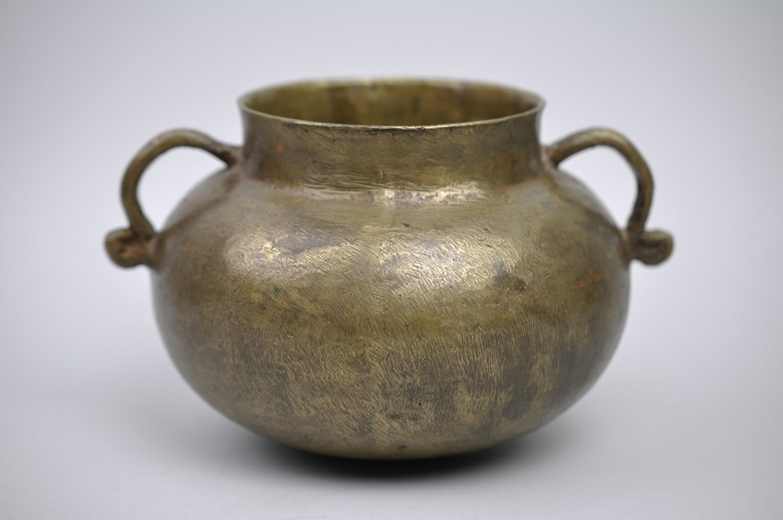 16th Century Bronze Cauldron Cooking Pot: Dimensions: 8x5" Condition: Has Some Scratches and Patina on Metal, No Major Visible Cracks Additional Information: This antique bronze cooking pot, dating to the 16th or 17th century,