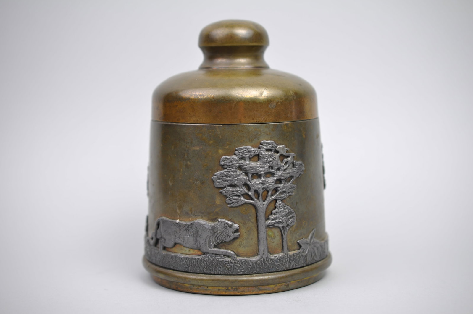 Brass Pewter w/ Etched Wildlife Tobacco Jar/Humidor: Dimensions: 6x4" Condition: Has Some Scratches and Patina on Metal Additional Information: This vintage brass and pewter humidor or tobacco jar features richly detailed relief scene of