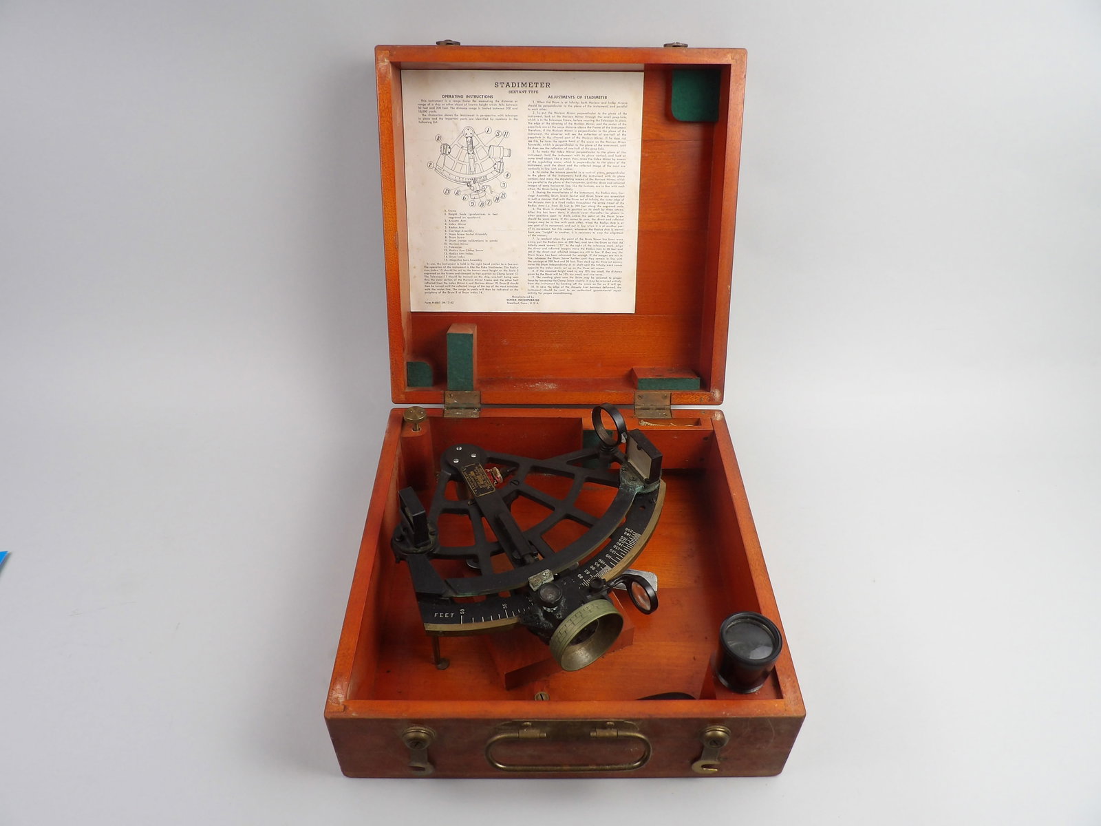 WWII U.S. Navy Stadimeter Complete: Manufacturer: Schick Incorporated of Stamford, Connecticut in 1944 Dimensions: Approx 11 1/2x11 1/2x5 Condition: Ship Travel Wear (Box), Light Oxidation on Rangefinder Ad