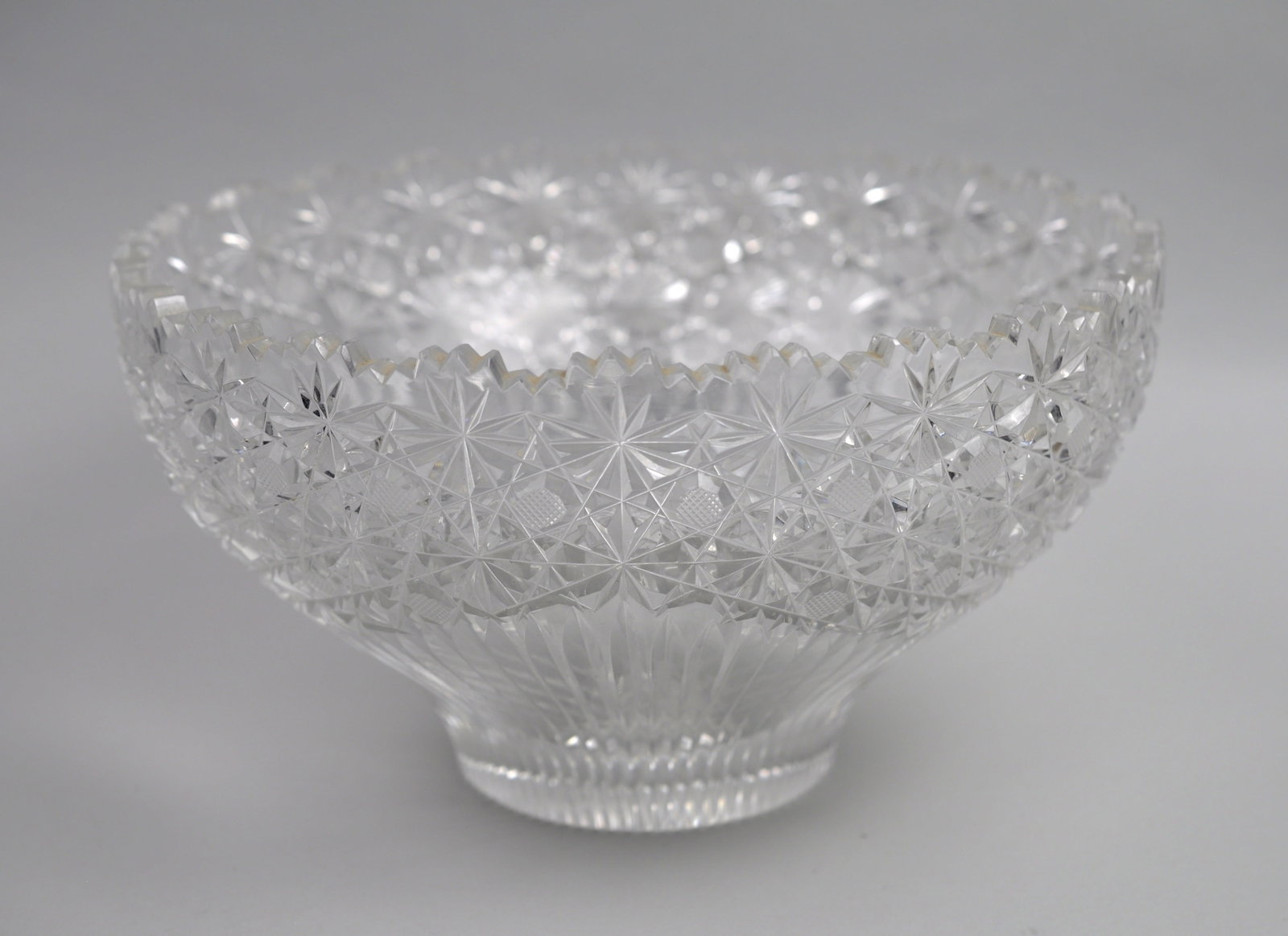 Crystal Hobstar Motif Bowl: Manufacturer: N/A- American Brilliant Period Dimensions: 9 3/4x 9 3/4x 5 /12 in. Condition: Light Scratches Additional Information: This large Antique Brilliant Period (ABP) crystal bowl is a refined
