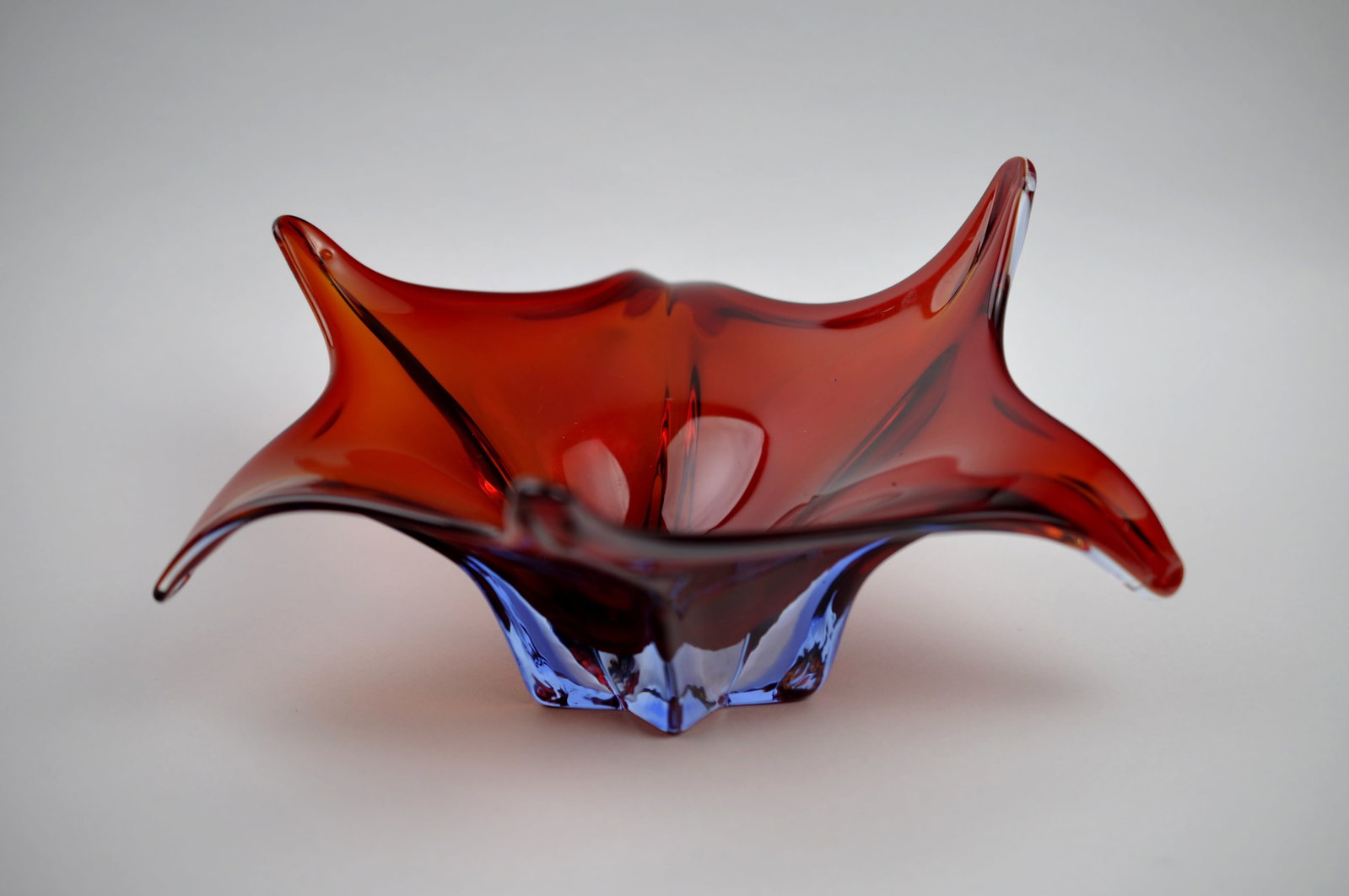 Murano Deep Red 6-Point Centerpiece Bowl: Medium: Glass Origin: Murano, Italy Dimension: Approx. 11 in. at the Widest Points, 5 in. at the Tallest Point Condition: 1/8" Marking to Underside of a Petal Additional Information: This striking