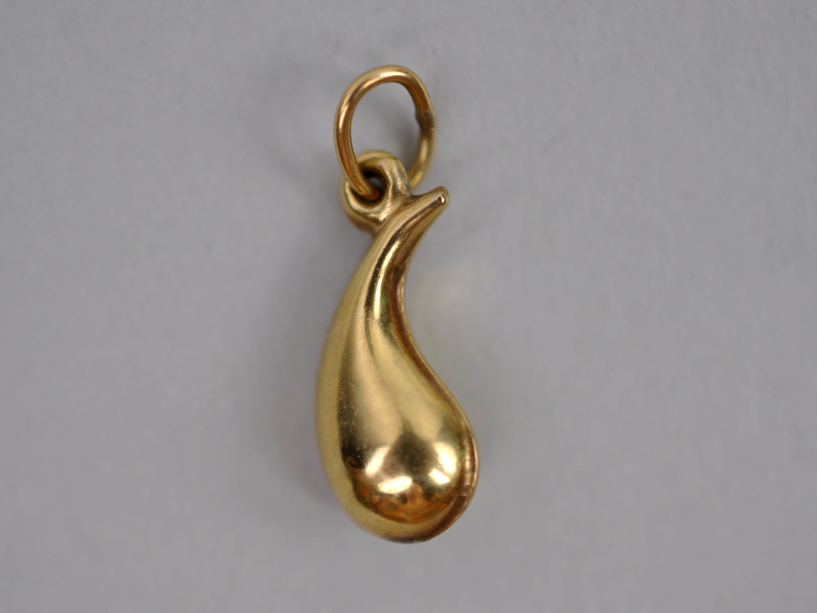 14K Gold Teardrop Pendant: Metal: 14K Yellow Gold Stone Types: N/A Dimensions: Approx. 0.5 in. Weight: Approx. 0.02ozt Condition: No Visible Flaws Additional Information: Petite 14K yellow gold teardrop pendant featuring a