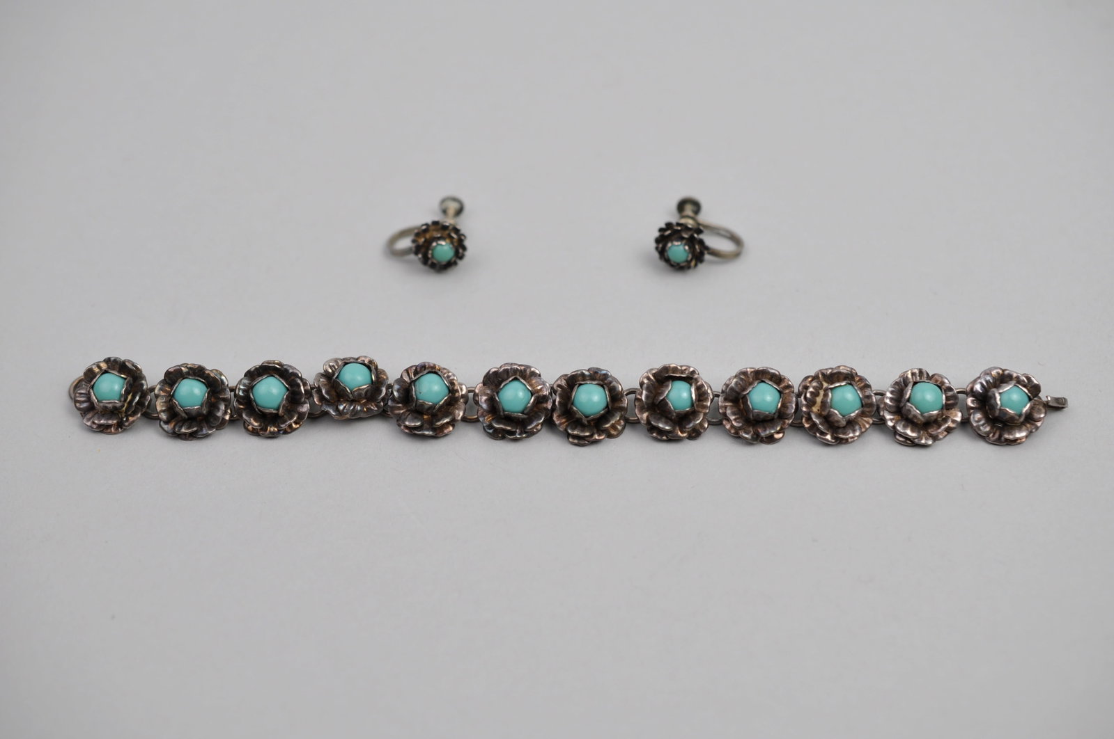 Sterling Silver Mexico Bracelet Earrings: Metal: Sterling Silver Stone Types: Turquoise or Turquoise-Colored Stones Dimensions: Bracelet Approx. 7 in.; Ea