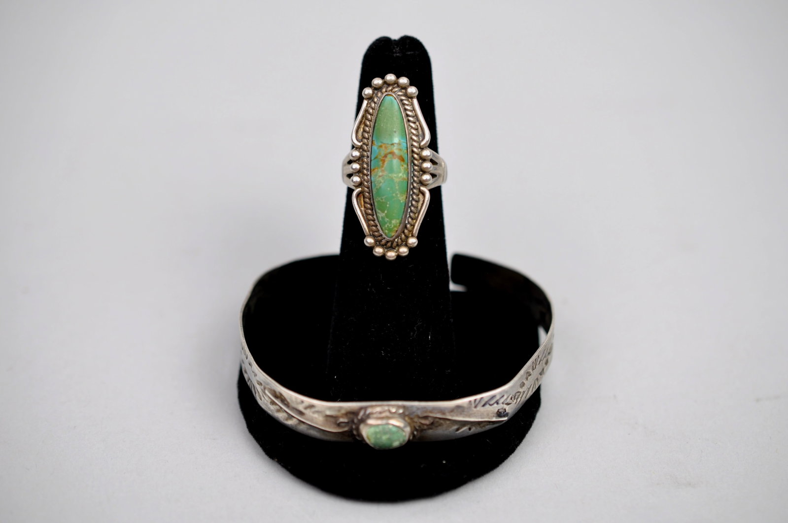 Silver Southwestern Turquoise Ring Bracelet: Metal: Unmarked silver, likely Mexican or Southwestern silver Stone Types: Turquoise Dimensions: Ring size 4.5; bracelet approximately 2.25 in. inner diameter Weight: 0.47ozt Condition: Surface wear