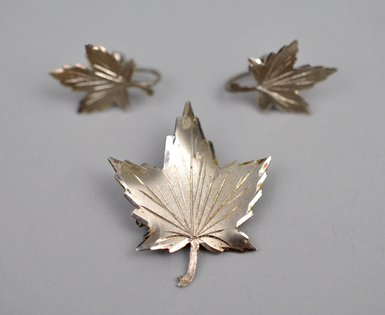 Sterling Silver Brooch Earrings: Metal: Sterling Silver Stone Types: None Dimensions: Brooch Approx. 1.5 in.; Matching Clip-On Earrings Approx. 0.75 in. Weight: Approx. 0.24ozt Combined Condition: Good Vintage Condition; Light