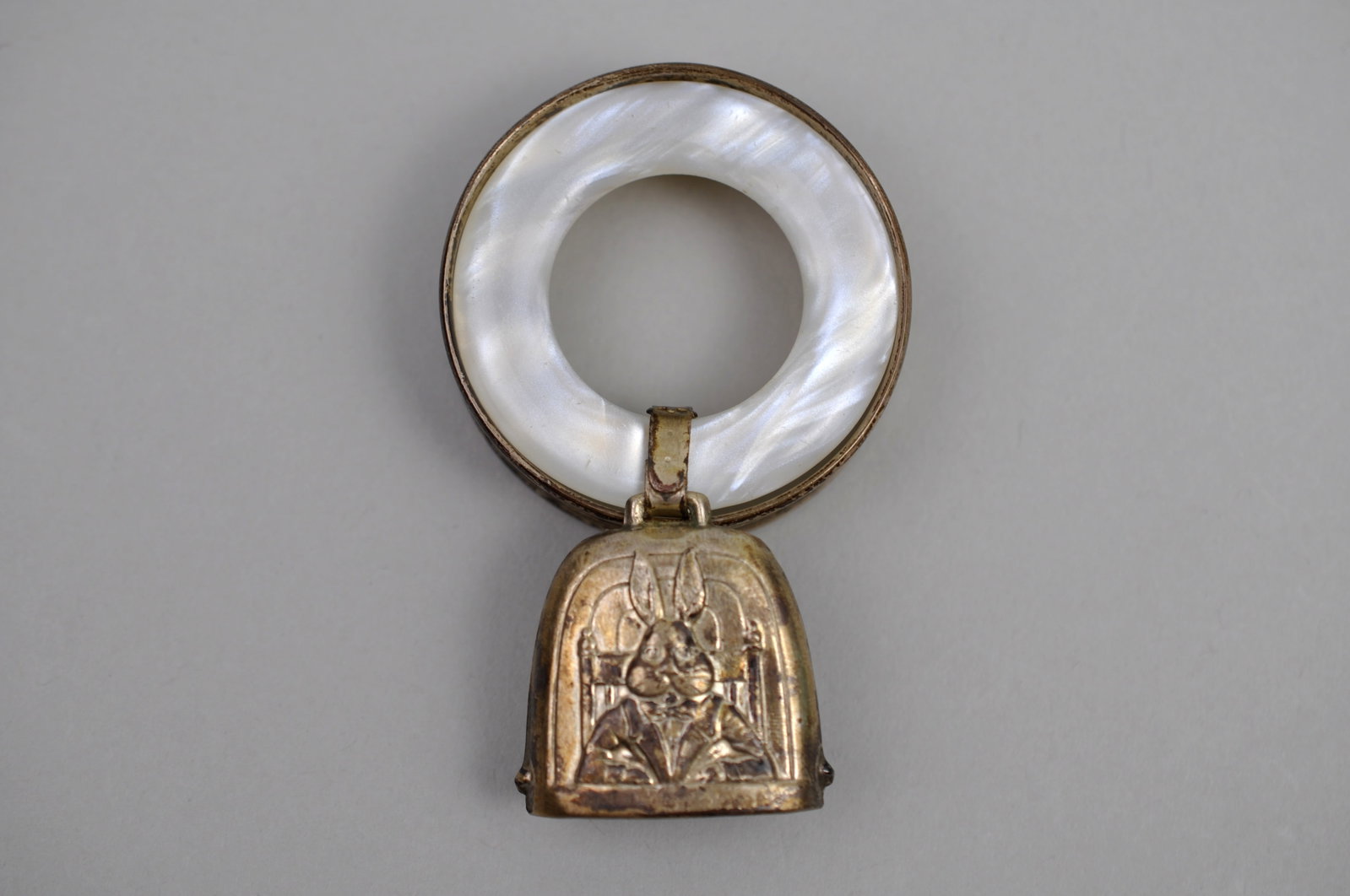 Sterling Silver Bracelet Baby Rattle: Metal: Sterling Silver Stone Types: Mother-of-Pearl Ring; No Gemstones Present Dimensions: Mother-of-Pearl Ring Approx. 1.5 in. Diameter; Rattle/Charm Approx. 1 in. Weight: Approx. 0.47ozt Combined
