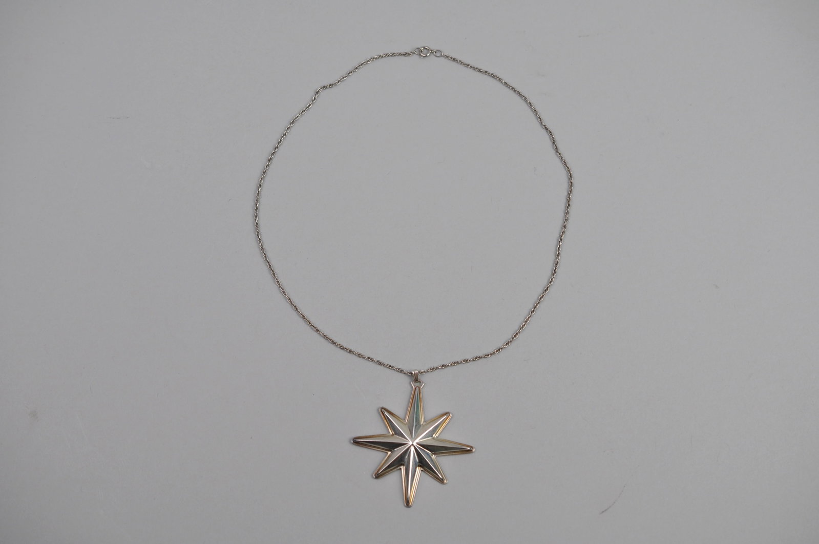 Reed & Barton Sterling Silver Pendant Chain 1976: Metal: Sterling Silver Stone Types: None Dimensions: Star Approx. 2 in.; Chain Approx. 18 in. Weight: Approx. 0.41ozt Condition: Light Surface Wear Consistent with Age and Use; Chain and Spring Ring