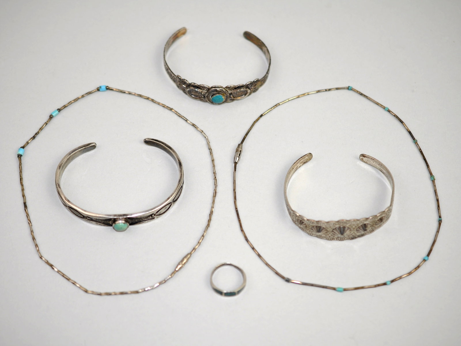 Southwest Jewelry Bracelets Ring Necklaces: Metal: Unmarked White Metal Stone Types: None observed Dimensions: Necklace approximately 10 in.; bracelet approximately 2.5 in. interior diameter Weight: 1.94 ozt Condition: Surface wear consistent