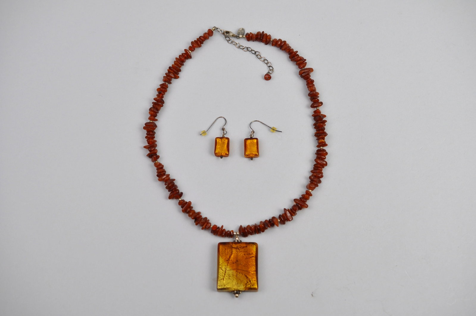 Lucky Clover Necklace Earrings: Maker: Lucky Clover Type: Necklace and matching dangle earrings Dimensions: Necklace approximately 16 in. L; pendant drops approximately 1 in.; earrings approximately 1 in. H Weight: 1.32ozt