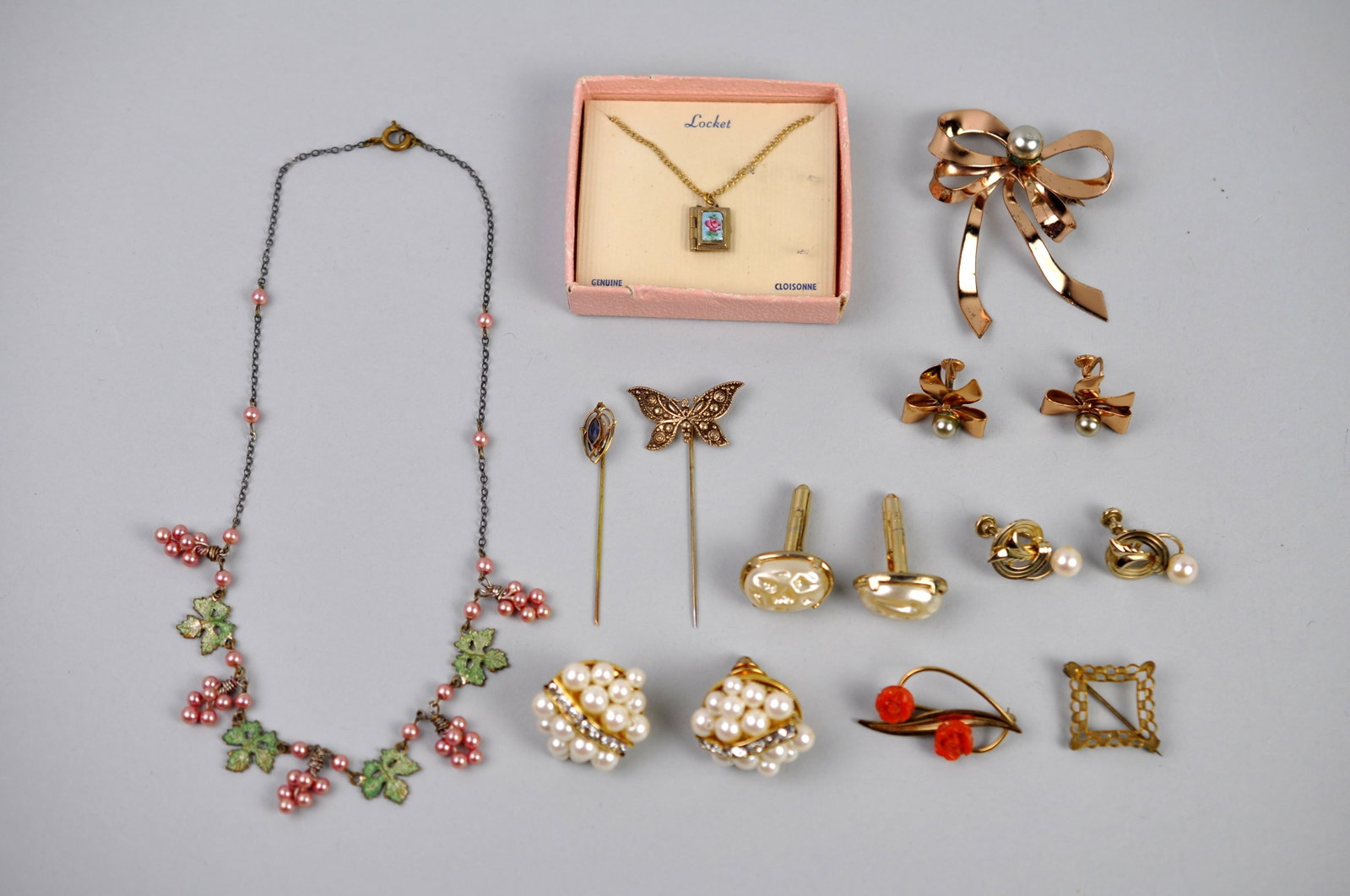Gold Tone Faux Pearl Jewelry: Metal: Gold-tone costume jewelry metals Stone Types: Faux pearls, rhinestones, enamel, glass accents Dimensions: