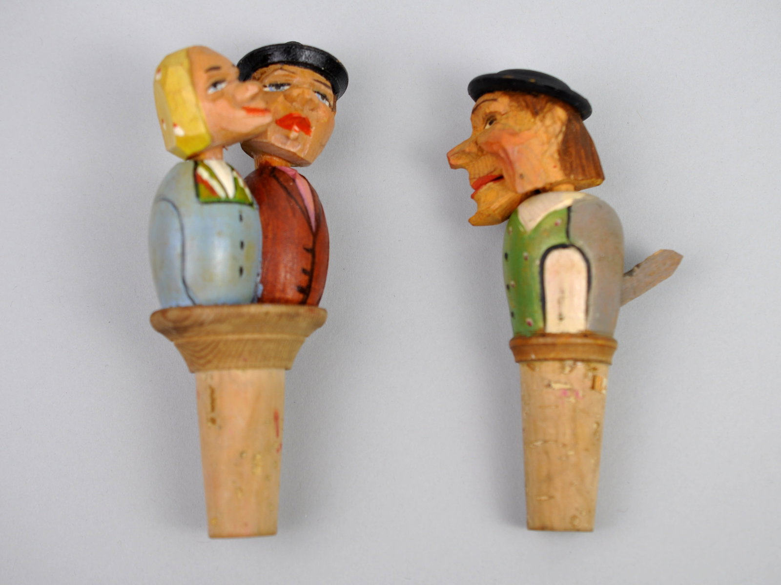 Anri Italian Hand-Carved Bottle Stoppers: Manufacturer: Anri Dimensions: Approx. 5 in. Each Condition: Minor Markings to Cork Additional Information: This delightful set of two ANRI Italian hand-carved bottle stoppers showcases the whimsical