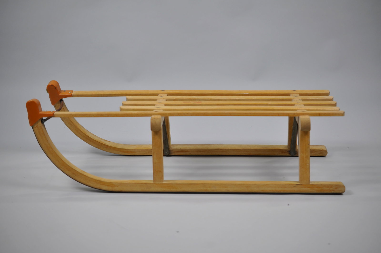 West-German Gloco Wooden Sled: Manufacturer: Gloco Davoser Dimensions: Approx. 35x13 1/2x9 in. Condition: Lacquer Finish Fading Additional Information: A Gloco Davoser West-German wooden sled embodies classic European