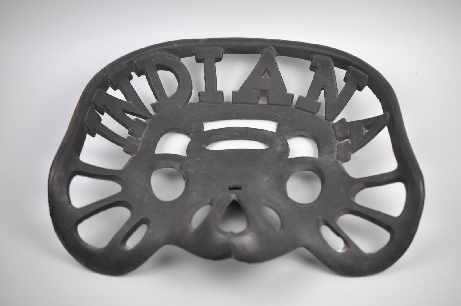 "Indiana" Iron Tractor Seat: Manufacturer: Indiana Silo & Tractor Company Dimensions: Approx. 13 1/4x14 1/4x3 1/2 in Condition: Has Weld Repair to Underside Additional Information: This cast iron "Indiana" tractor seat is a