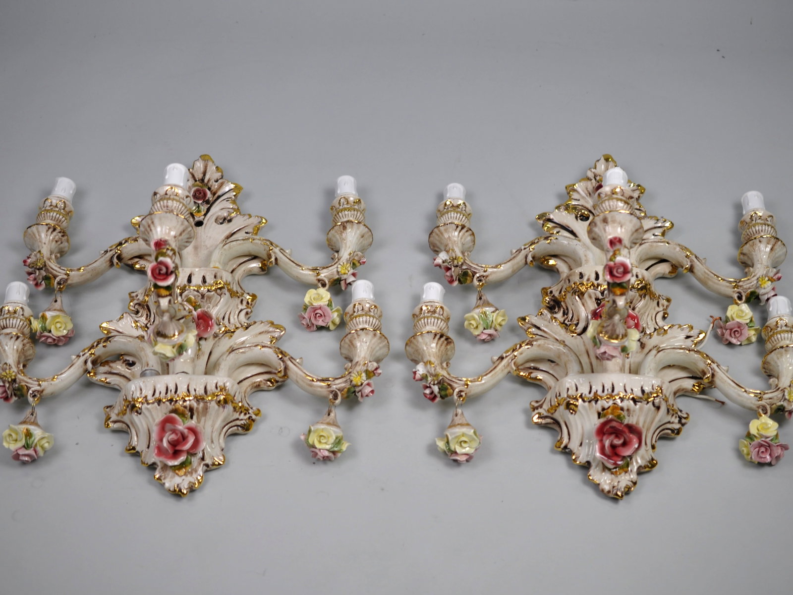 Capodimonte Sconces Five Arm Set: Dimensions: Approx.19x18 in. Condition: Untested, Some Arms have Repairs Made to Them. May Contain Hairline Cracks and Small Chips Additional Information: A set of five-armed Capodimonte chandelier