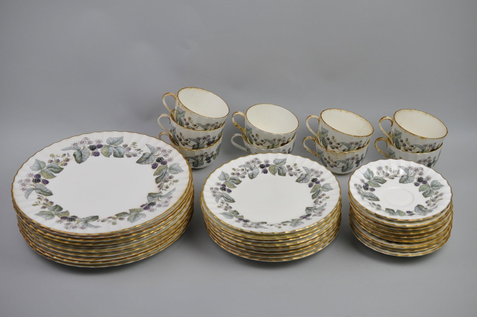 Royal Worcester Blackberry Vine Dishware Set: Manufacturer: Royal Worchester Dimensions: Various Condition: Teacups Have Stains and Small Cracks Additional Information: Royal Worcester Fine Bone China featuring the elegant Blackberry Vine