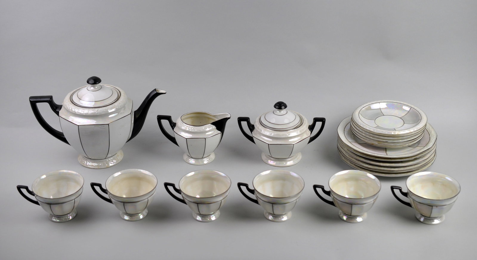 Czechoslovakia PALT White Pearl Tea Set: Manufacturer: Porzellanfabrik Adolf Laufer Dimensions: Various Condition: Light Yellow Hue to Inside of Teacups Additional Information: This elegant Czechoslovakia PALT white pearl iridescent tea set