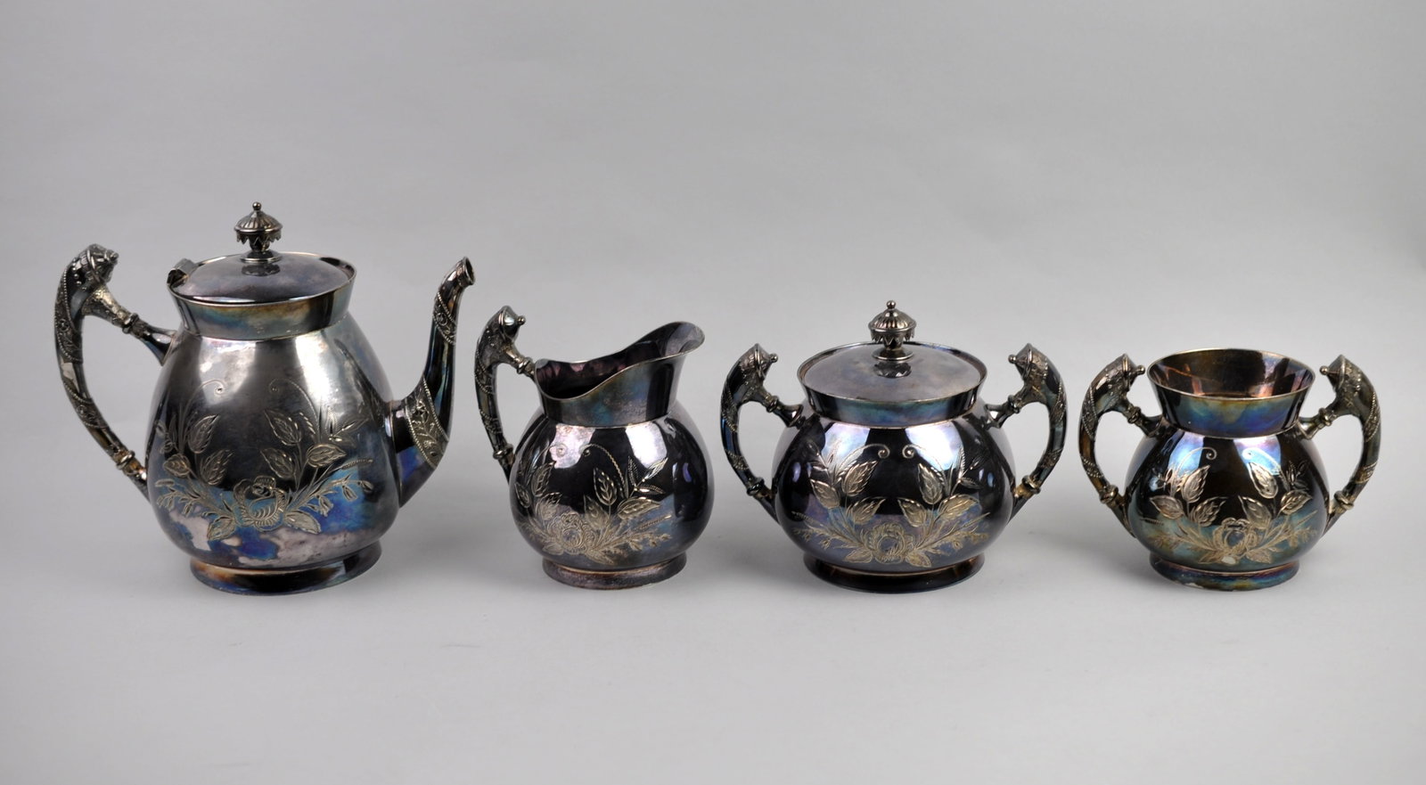 Wm. Rogers Tea Set: Manufacturer: Wm. Rogers Dimensions: Various Condition: Moderate Patina and Light Scratches Additional Information: This elegant four-piece Wm. Rogers quadruple plated silver tea set is a fine
