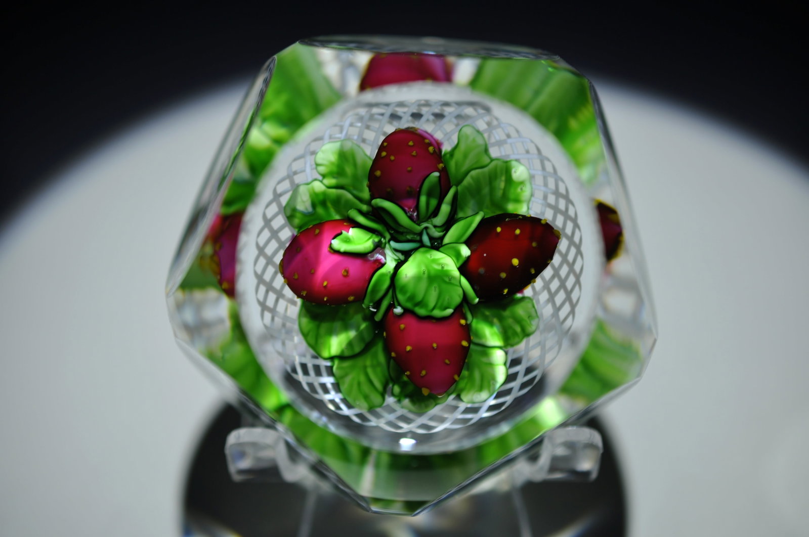 Saint Louis 1982 Strawberry Weight: Attributed Brand: Cristal de France, Saint Louis Period: 1982 Style: Signature Cane, Motif, Latticinio Base: Clear Diameter: 2.62 in. Weight: 1.13 lb Condition: No obvious flaws. Additional