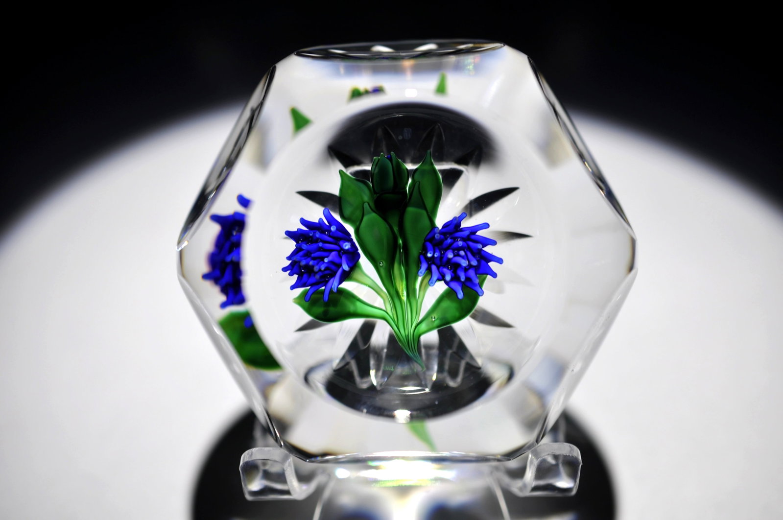 St. Louis 1979 "Bleuet de Neenah": Attributed Brand: Cristal de France, Saint Louis Period: 1996 Style: Motif, Signature Cane, Faceted, Lampwork Base: Clear, Star Cut Diameter: 3.08 in. Weight: 1.23 lb Condition: Base Wear. Additional