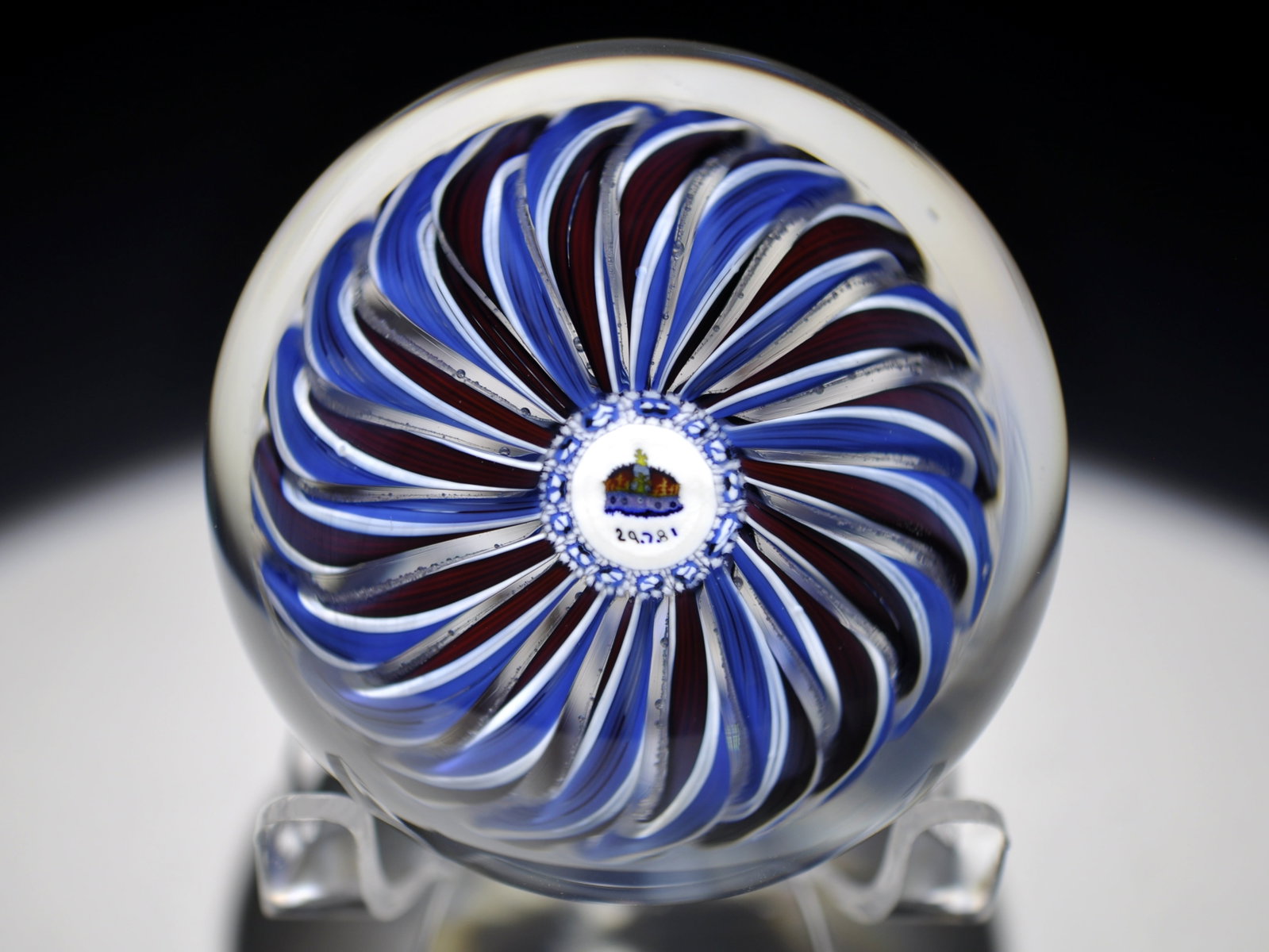 Perthshire Crown Paperweights: Attributed Brand: Perthshire, Crieff Scotland Period: 1981 Style: Millefiori, Signature Cane Base: Clear Diameter: 2.61 in. Weight: 0.86 lb Condition: No obvious flaws Additional Information: A