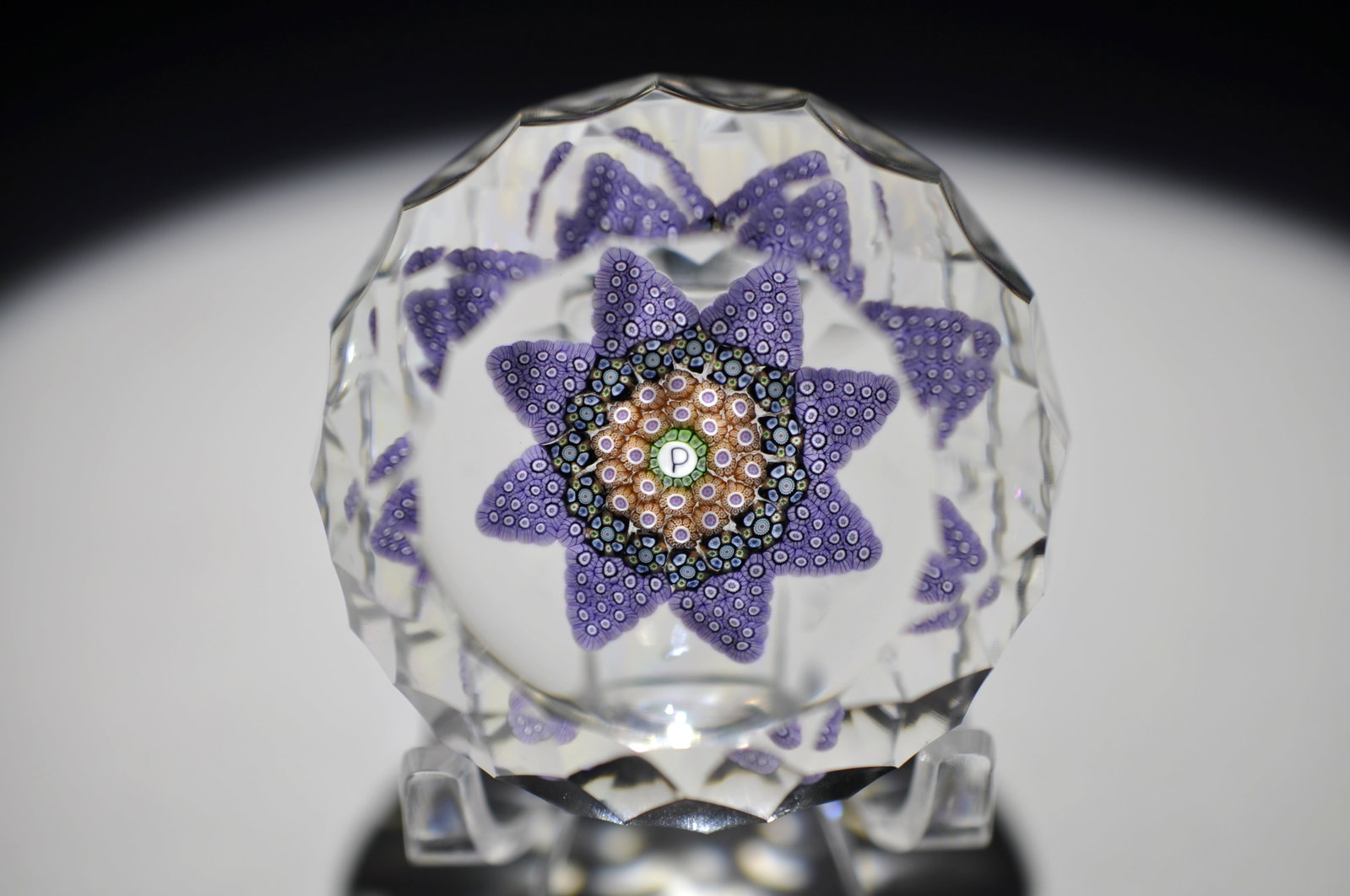 Perthshire 1982 Star Millefiori Weight: Attributed Brand: Perthshire, Crieff Scotland Period: 1982 Style: Signature Cane, Star Motif, Millefiori, Faceted Base: Clear, Star Cut Diameter: 2.15 in. Weight: 0.42 lb Condition: No obvious flaws.